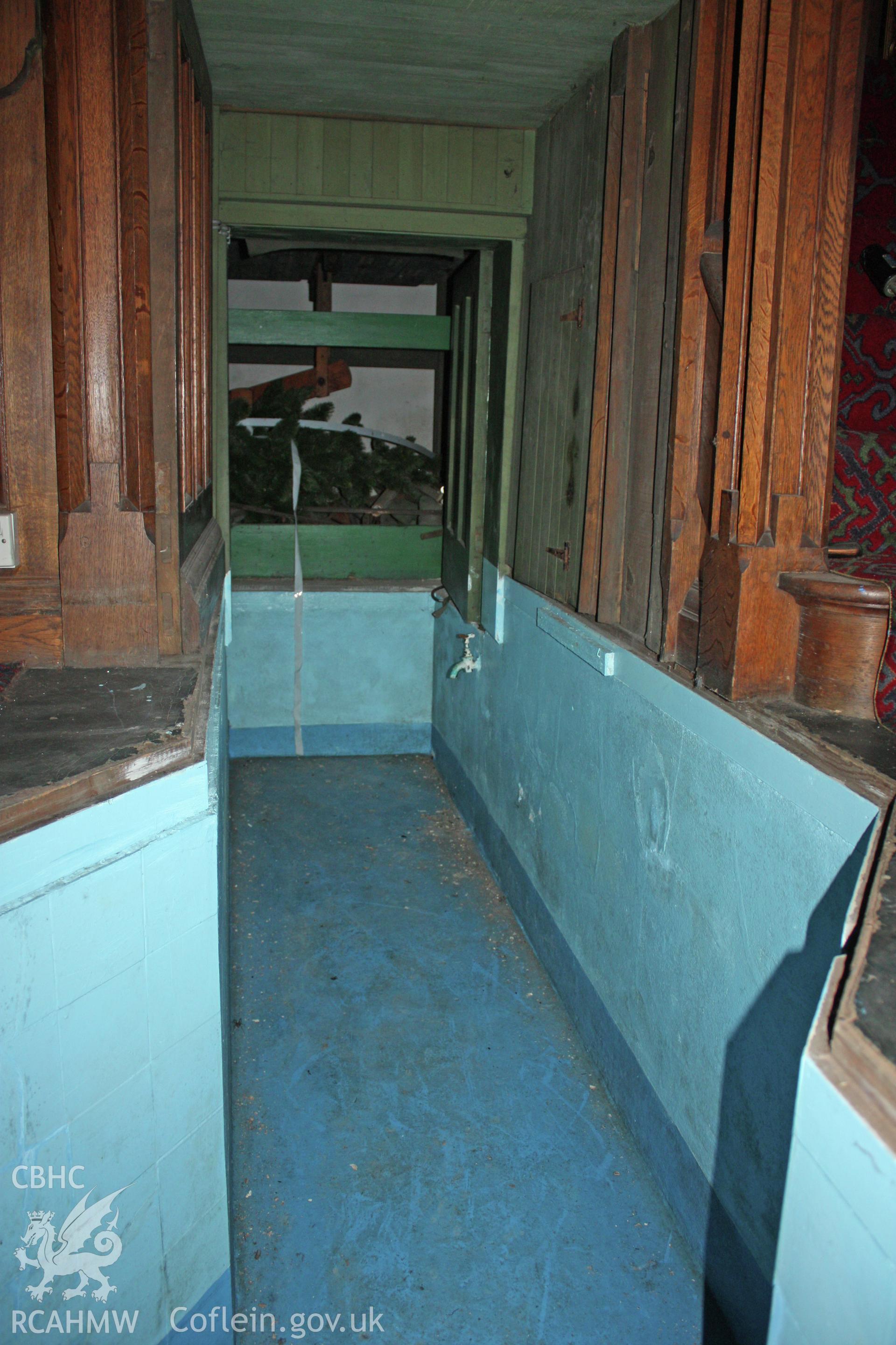 Walk-through from rear steps into main part of baptism pool