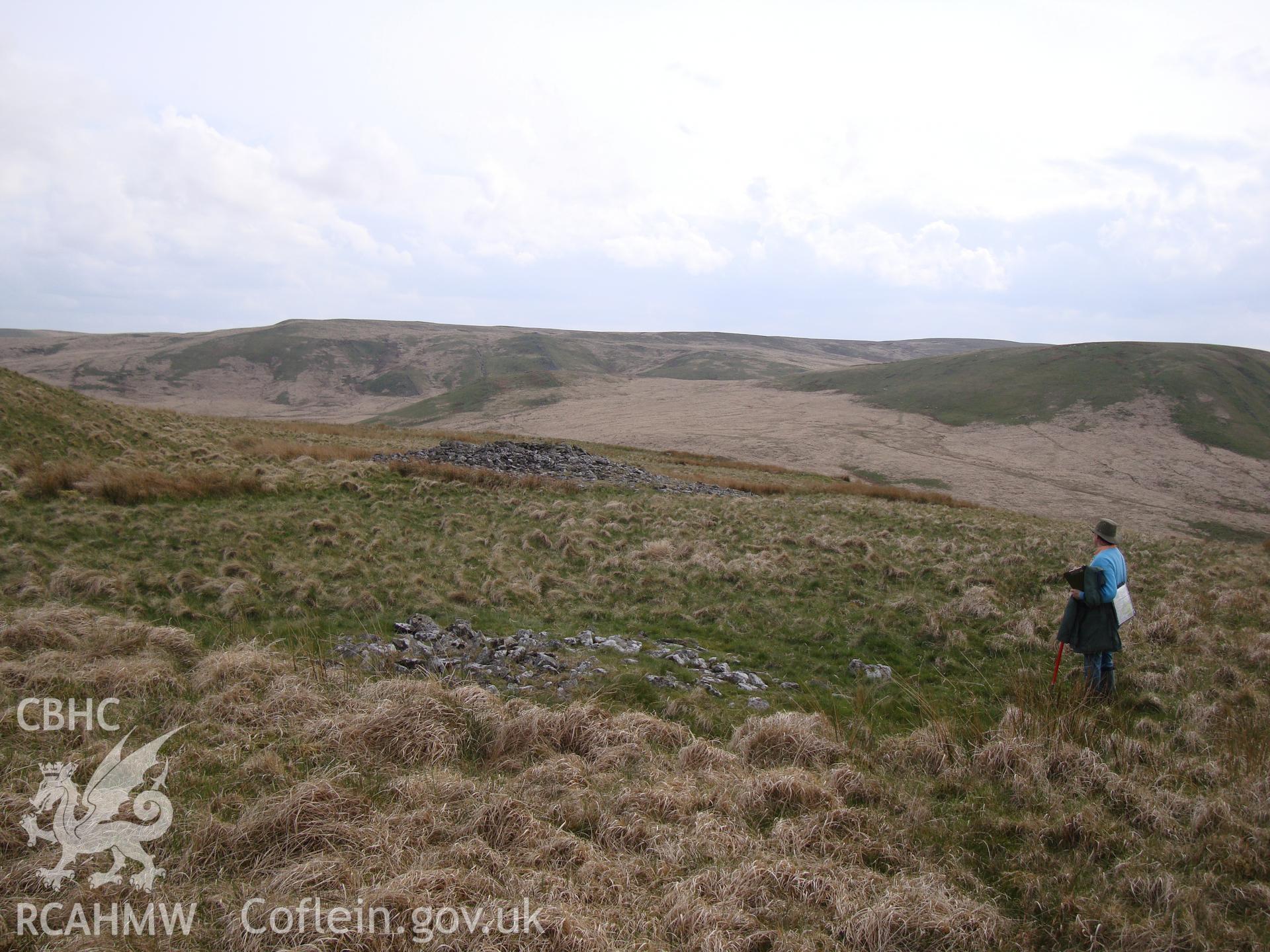 Bronze Age cairn, with larger one, NPRN 308692, in the background, looking south.