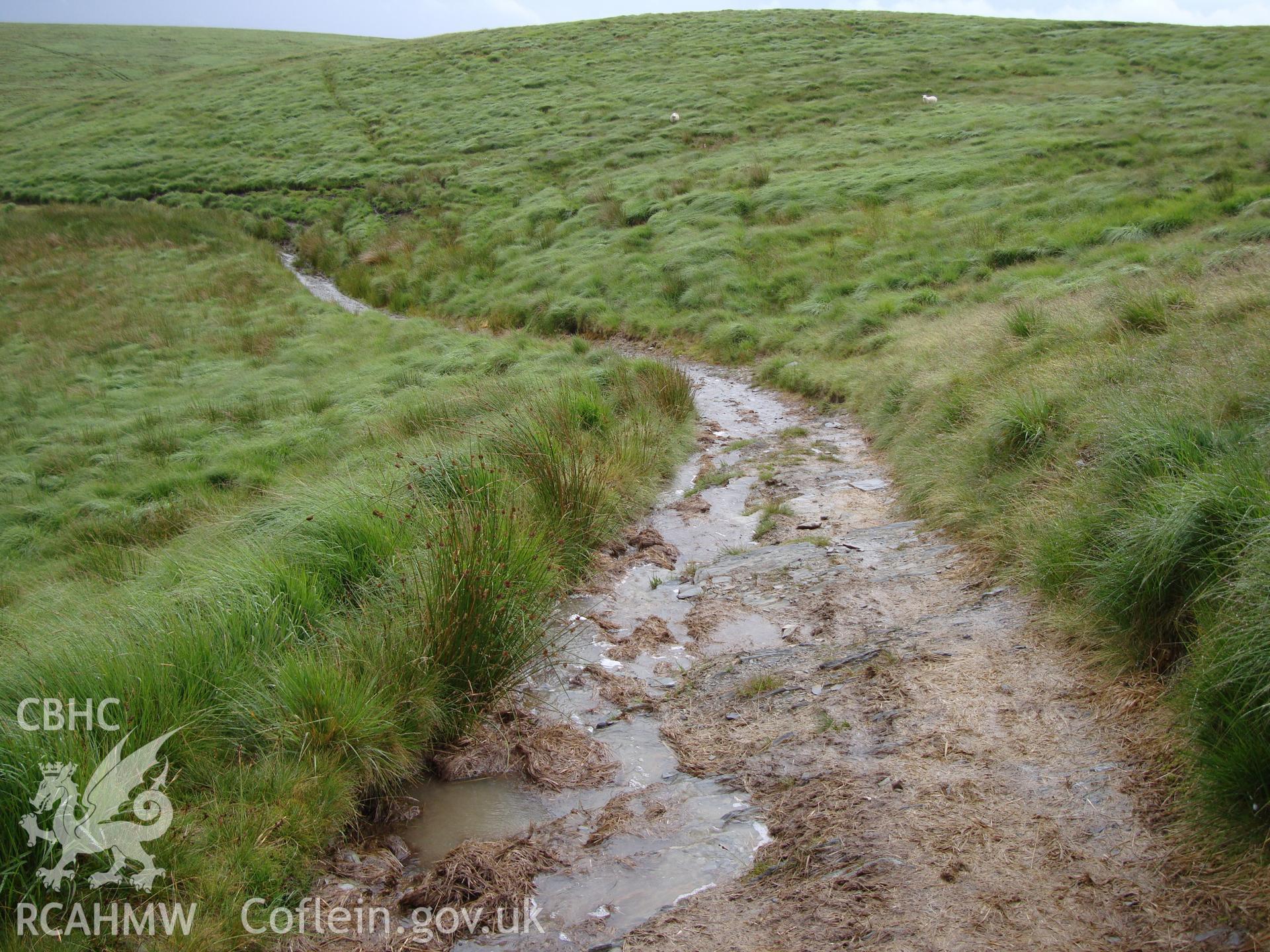 Trackway at SN8477669176, looking southeast.  The quantity of surface water visible is due to a recent downpour.