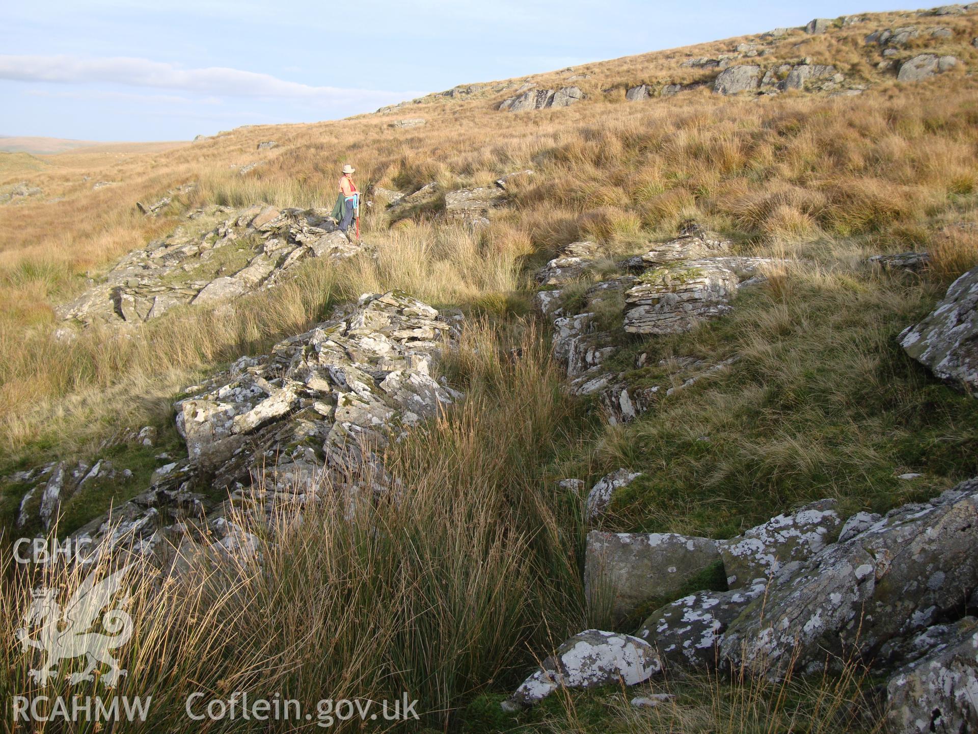 Detail of rock-cut leat, with shelter NPRN 503572 towards the top left of the photograph, looking east.