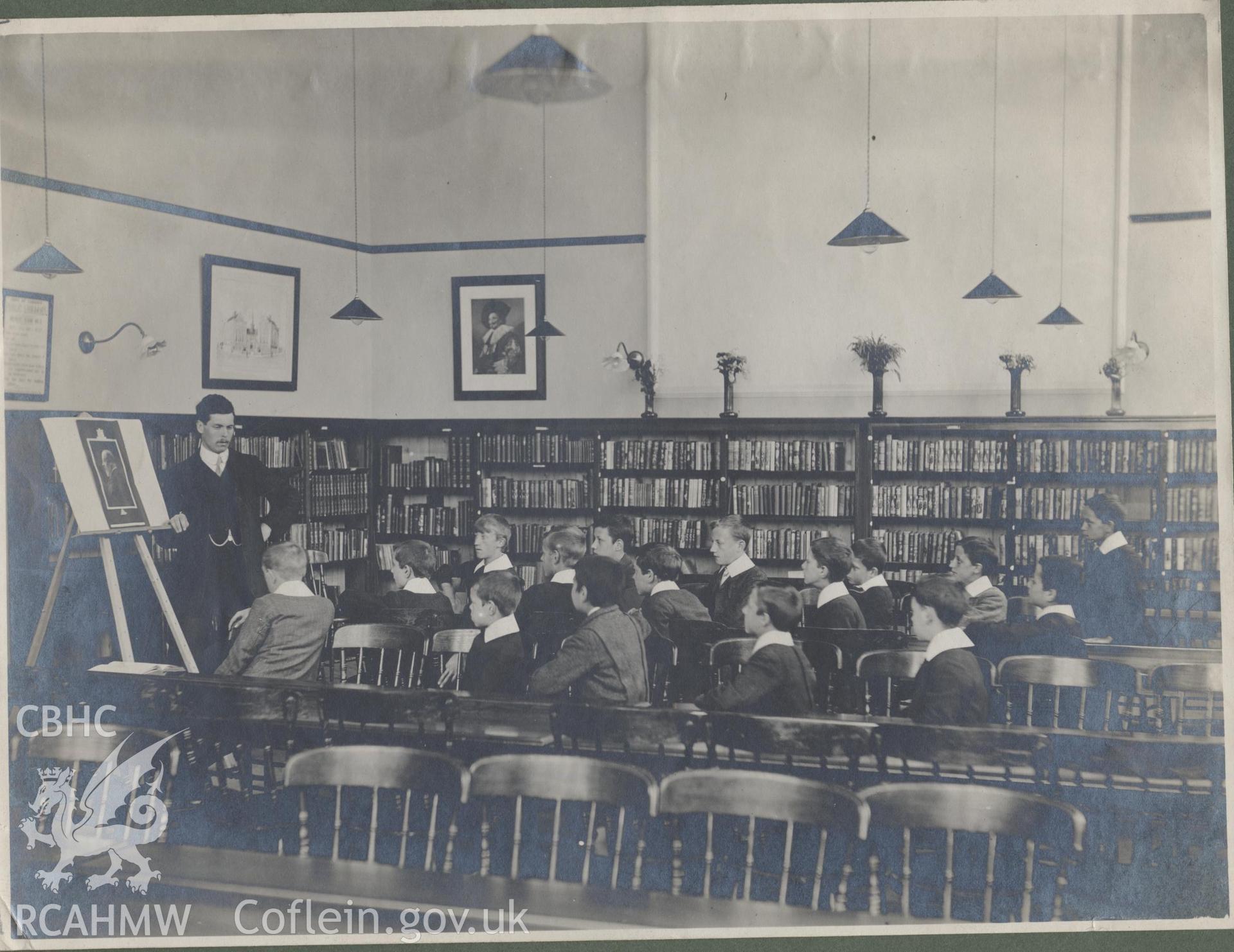 Black and white photograph showing school children working in Cathays Public Library, Cardiff.