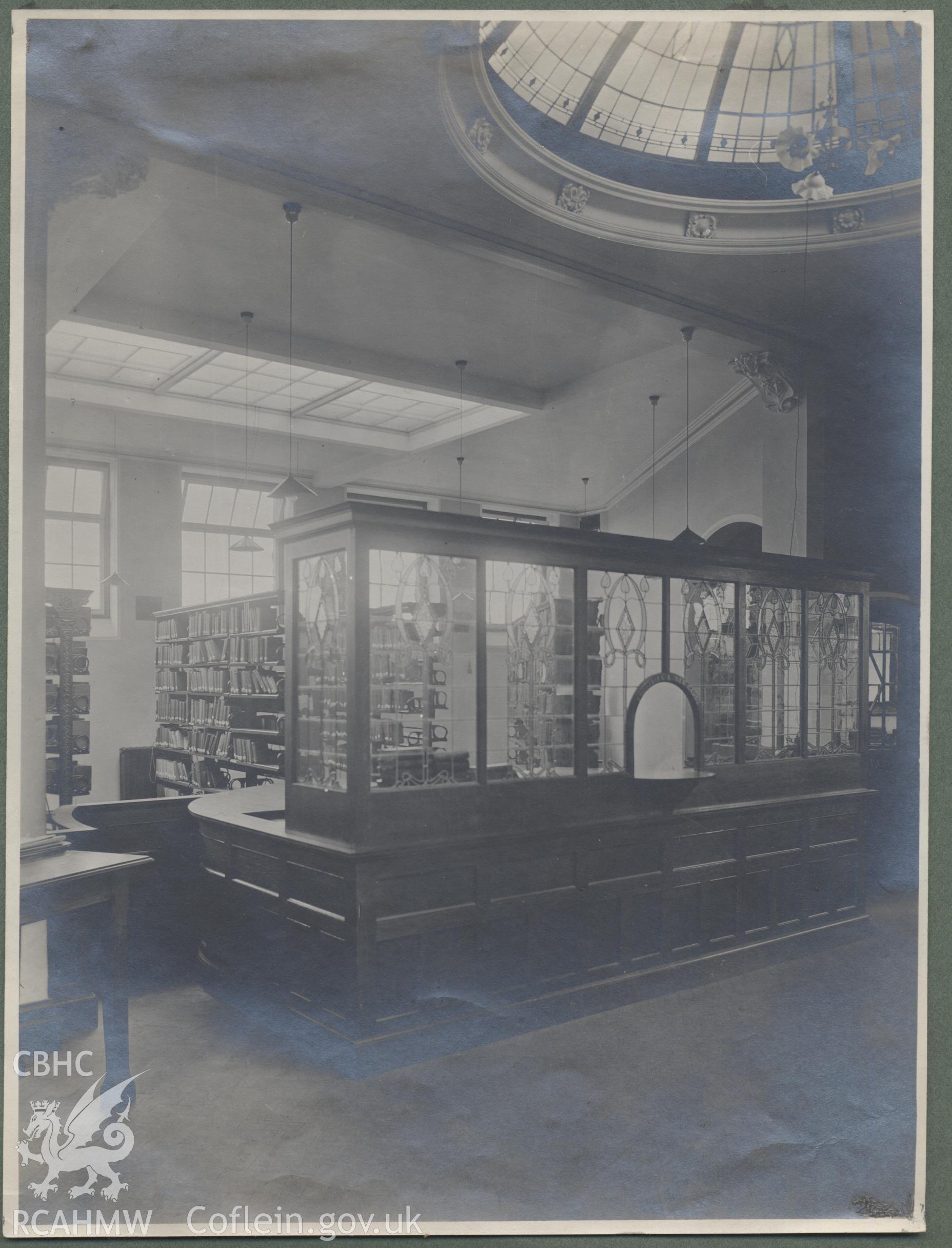 Black and white photograph showing part of the interior of Cathays Public Library, Cardiff.