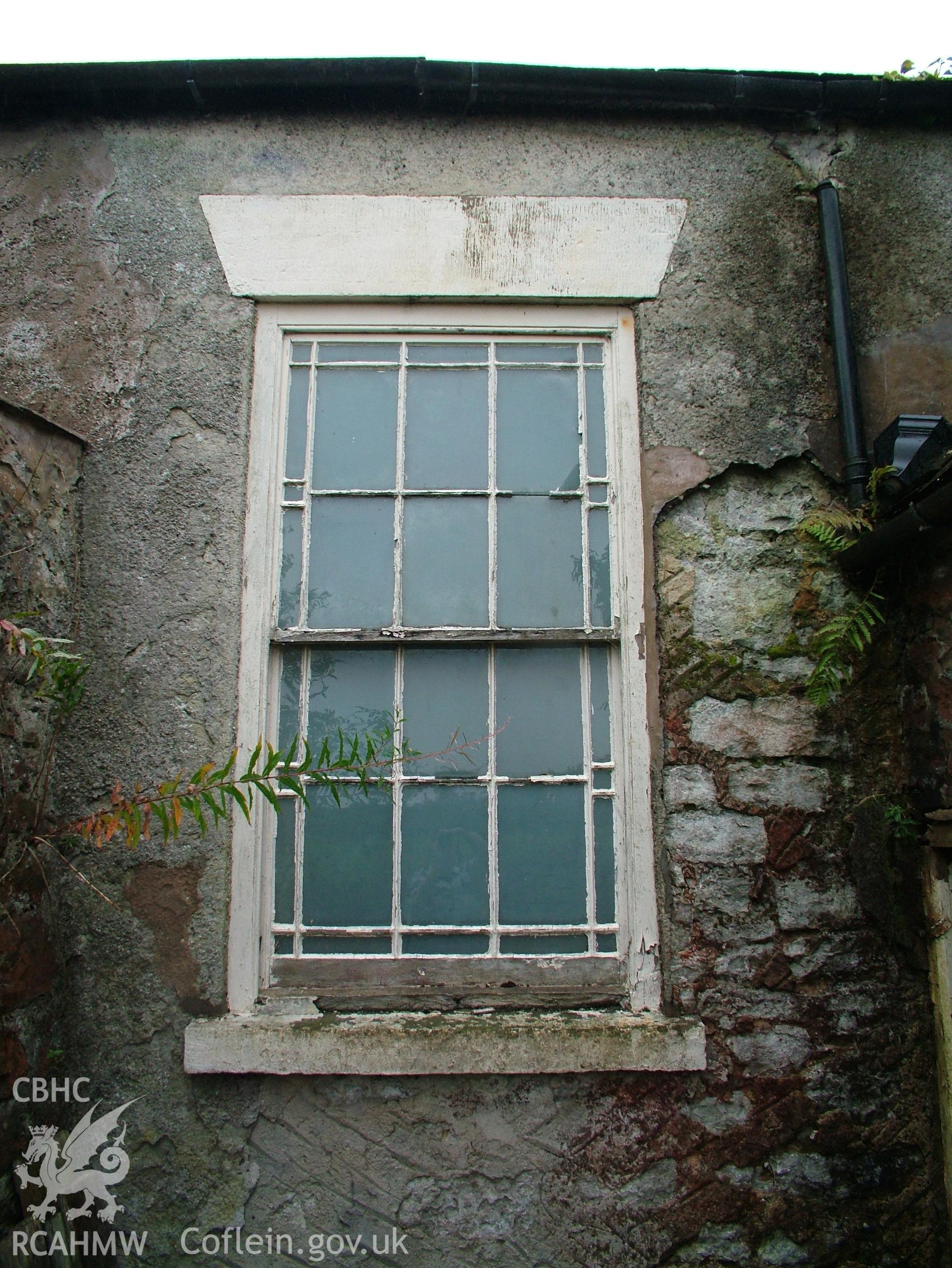 Digital colour photograph showing Llwynypandy chapel house - exterior view of window