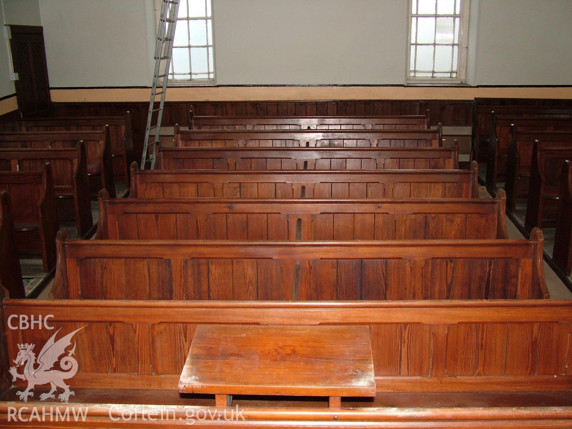 Digital colour photograph showing Llwynypandy chapel - interior view showing pews