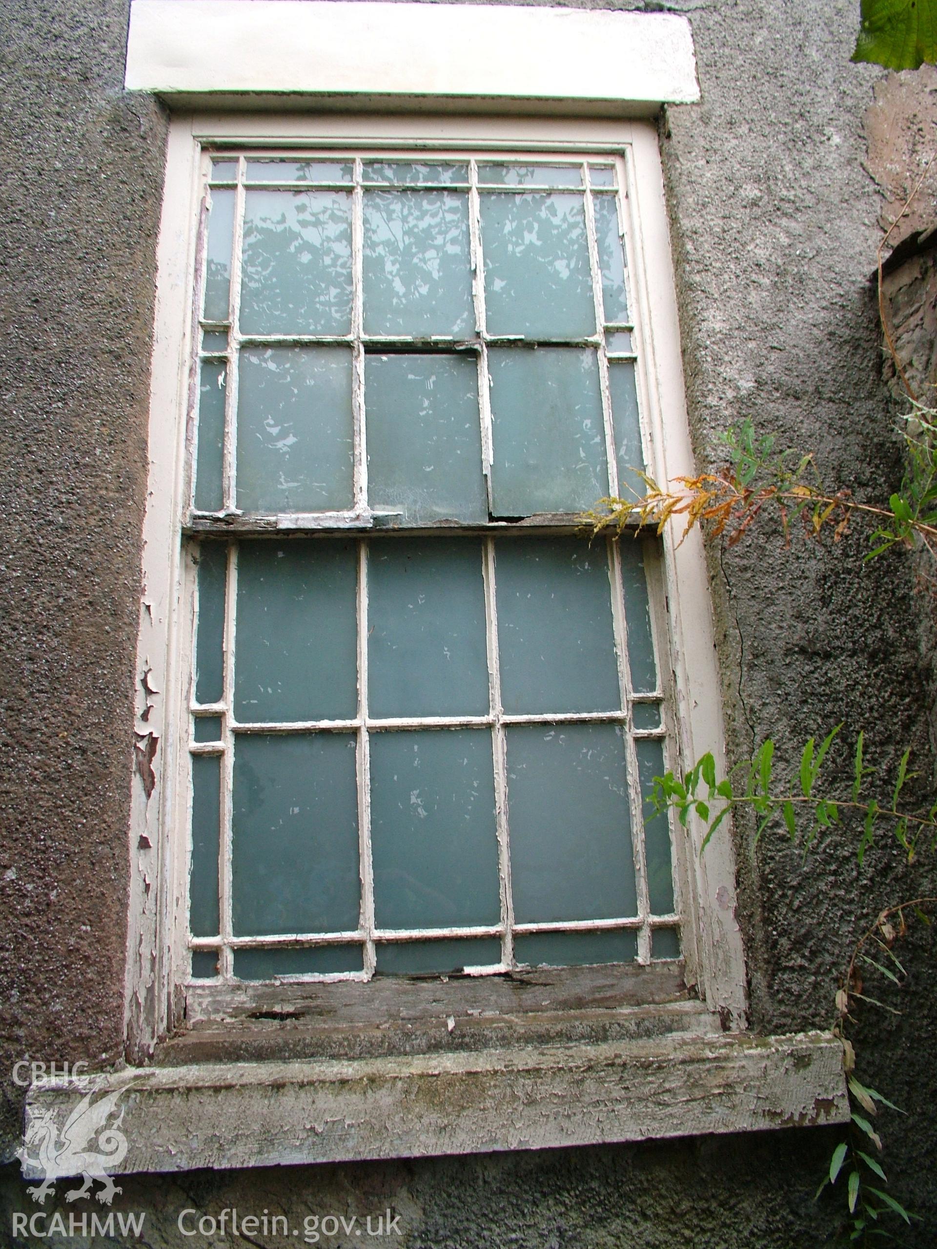 Digital colour photograph showing Llwynypandy chapel house - exterior view of window