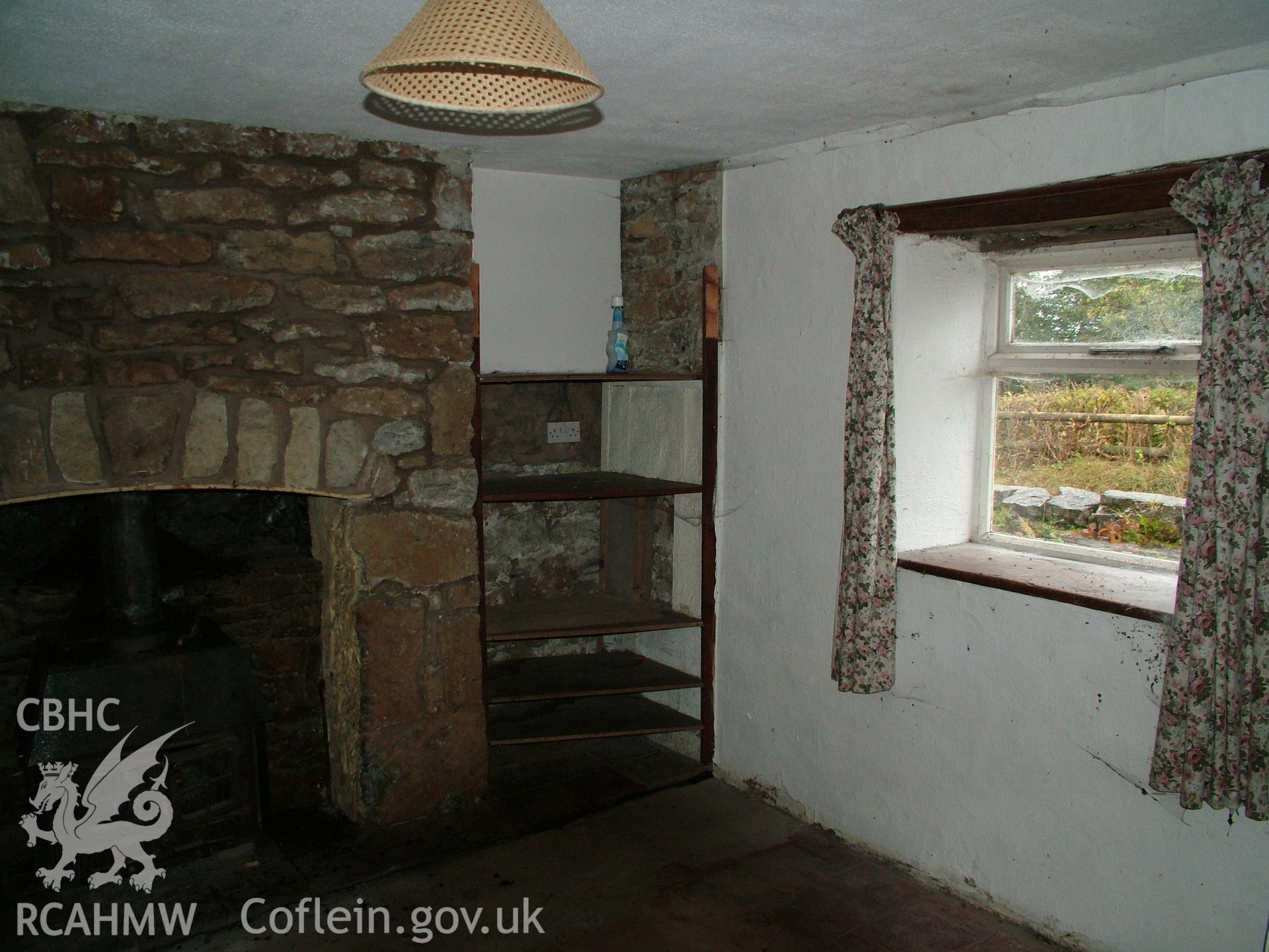 Digital colour photograph showing Llwynypandy chapel house - interior, view of window and fireplace
