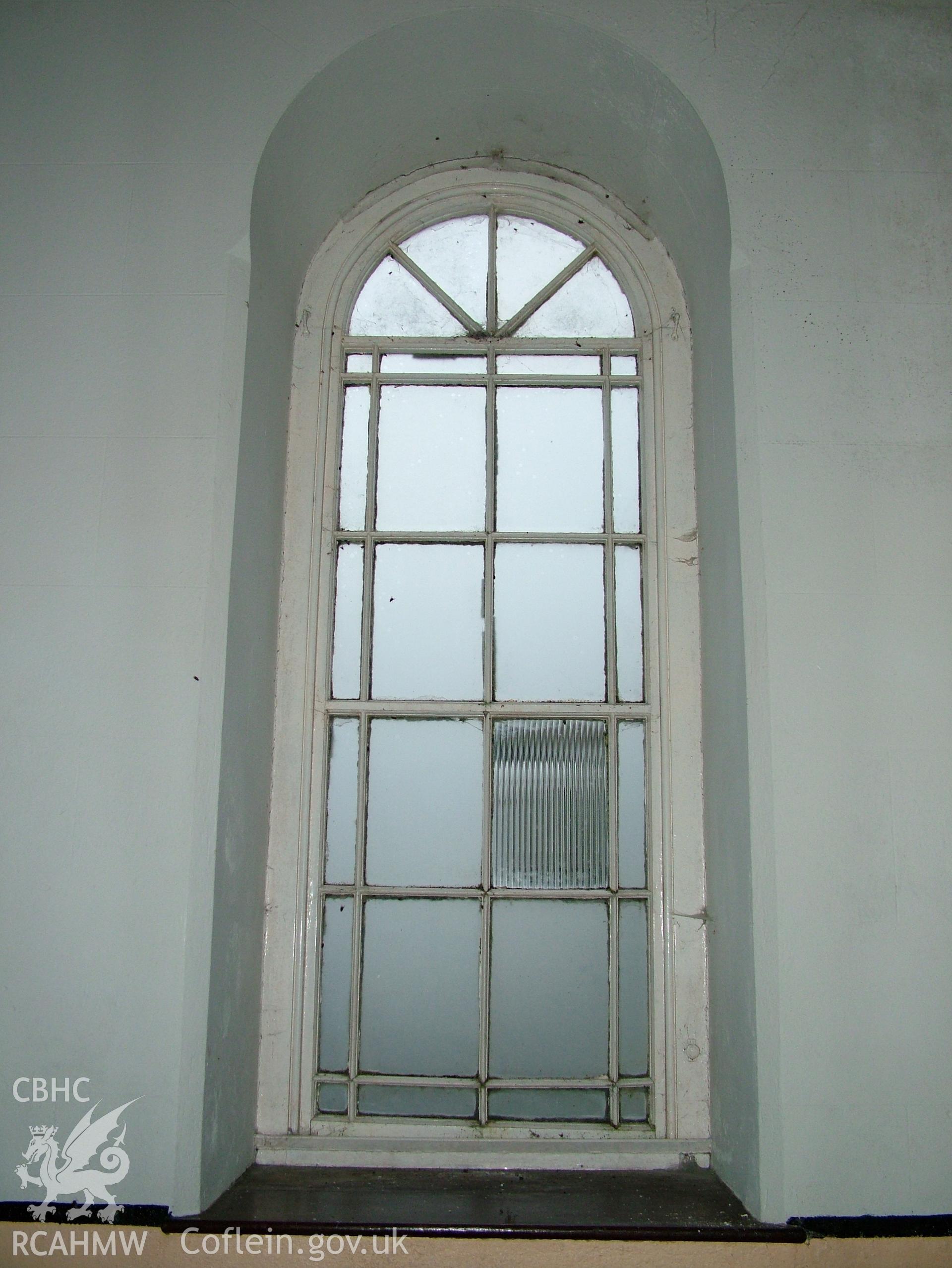 Digital colour photograph showing Llwynypandy chapel - interior view showing round-headed window