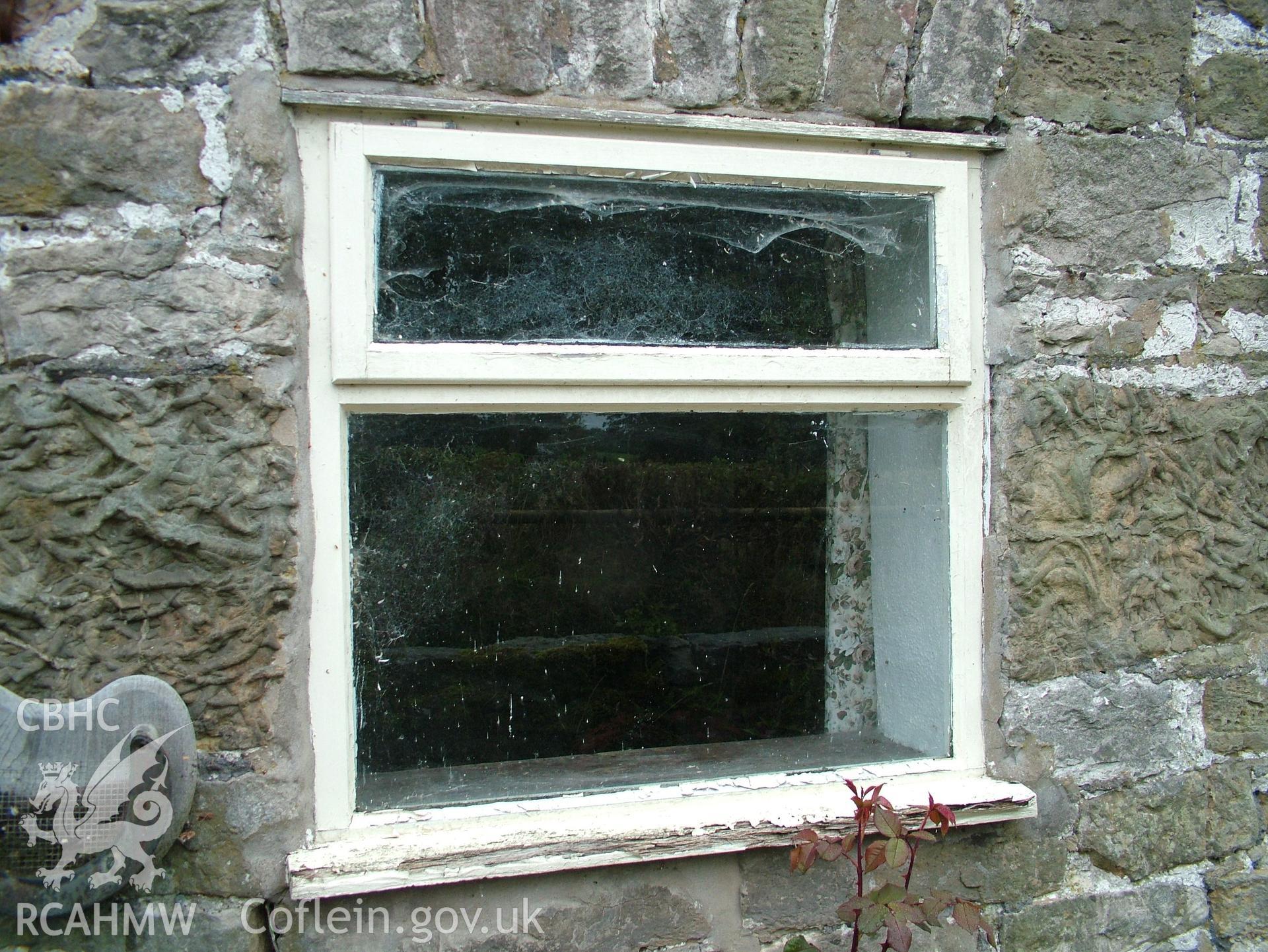 Digital colour photograph showing Llwynypandy chapel house - exterior view showing window