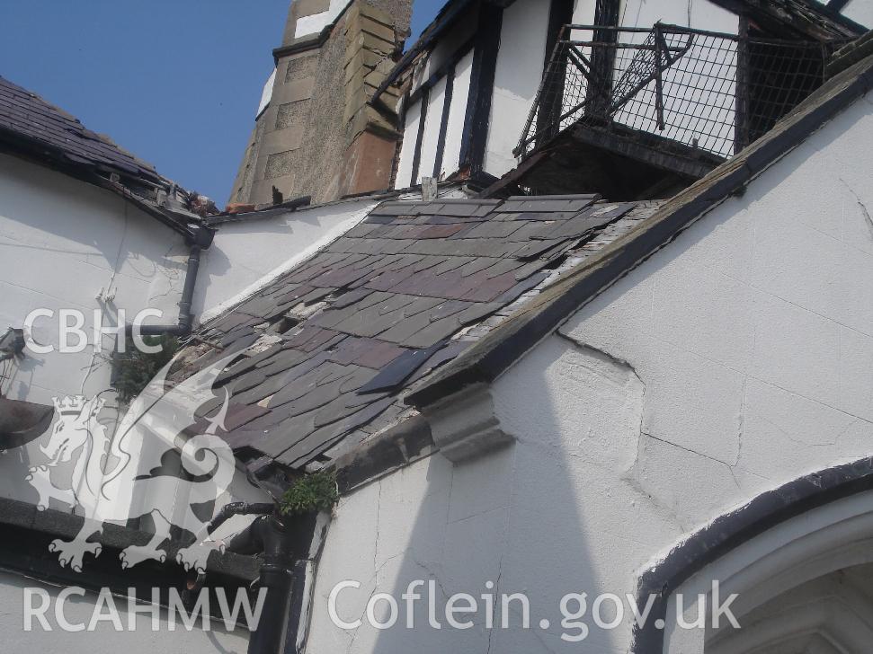 Colour photograph showing hand cut slate roof and chimney stack 02 in the west facing elevation of The Grange Hotel produced by JP Architects, 2011.