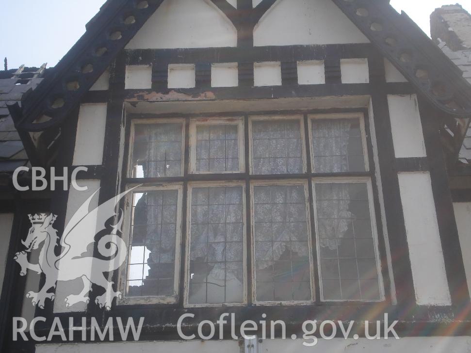 Colour photograph showing window 05 and fretted barge board 02 in the north facing elevation of The Grange Hotel produced by JP Architects, 2011.