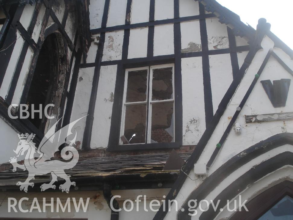 Colour photograph showing windows 09 and 10 and fretted barge board 03 in the north facing elevation of The Grange Hotel produced by JP Architects, 2011.