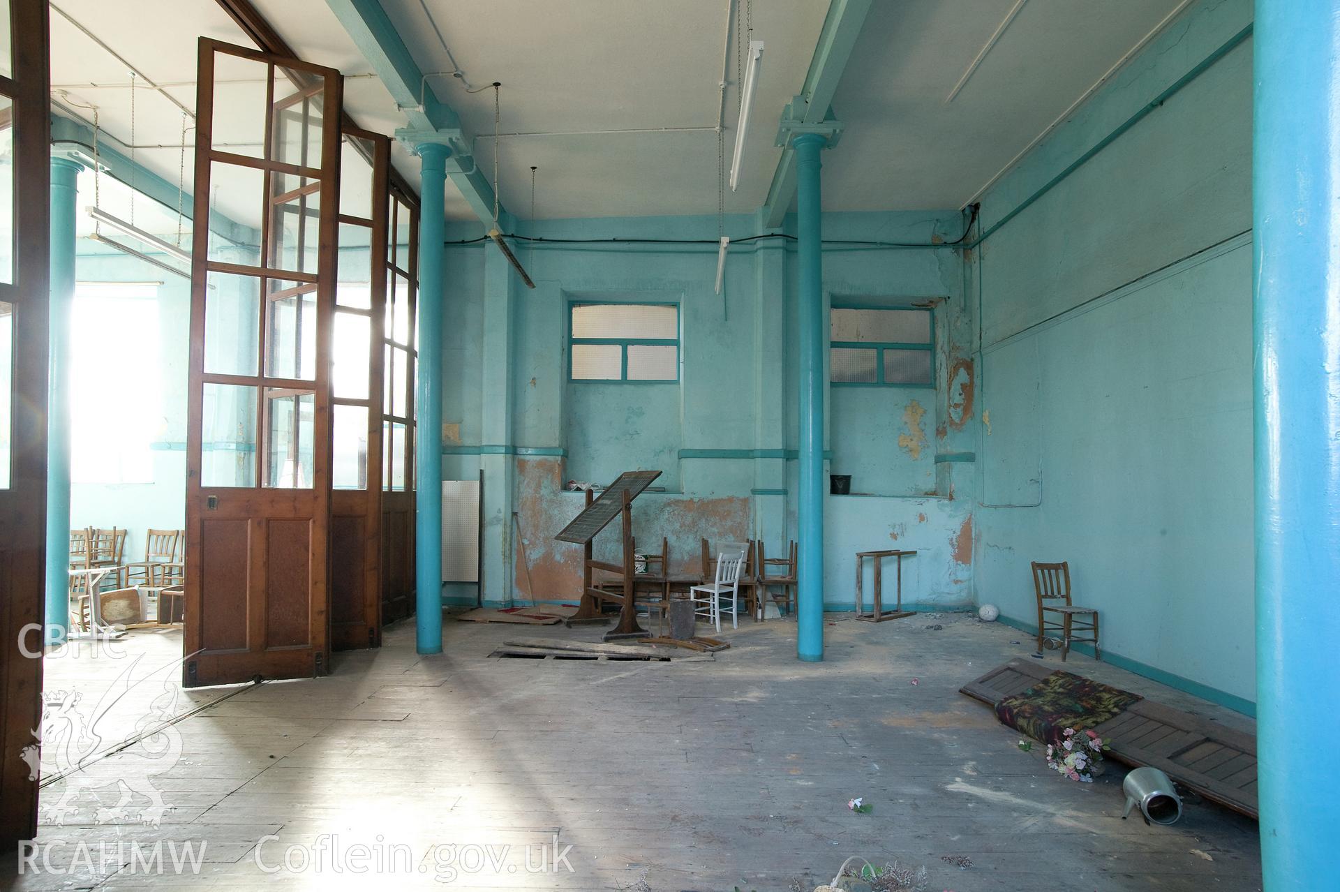 Hanbury Road baptist chapel, Bargoed, digital copy of a colour photograph showing school room with folding doors, received in the course of Emergency Recording case ref no RCS2/1/2247.