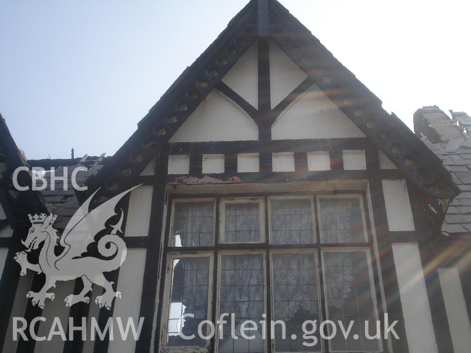 Colour photograph showing window 05 and fretted barge board 02 in the north facing elevation of The Grange Hotel produced by JP Architects, 2011.