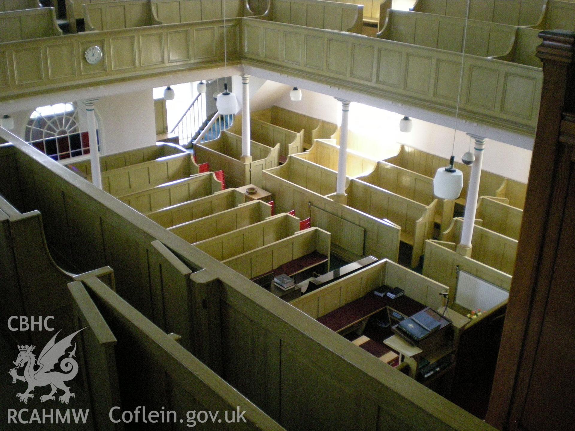 Colour photograph showing interior view looking down from the gallery.