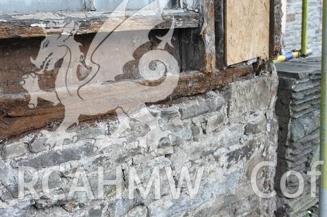 Exterior view showing detail of dining room elevation following plaster removal, with scaffolding.