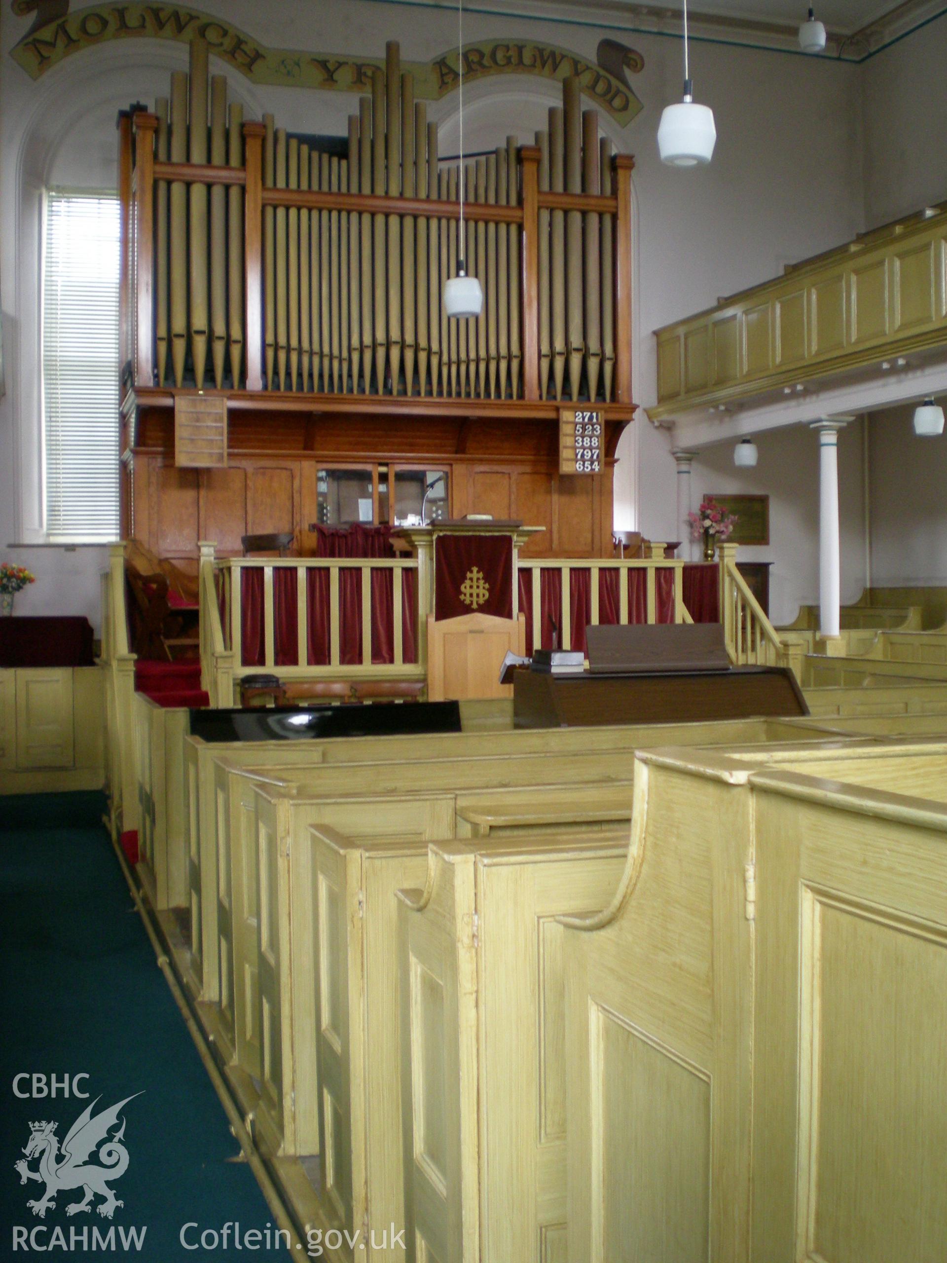 Colour photograph showing interior view of the chapel looking toward the organ.