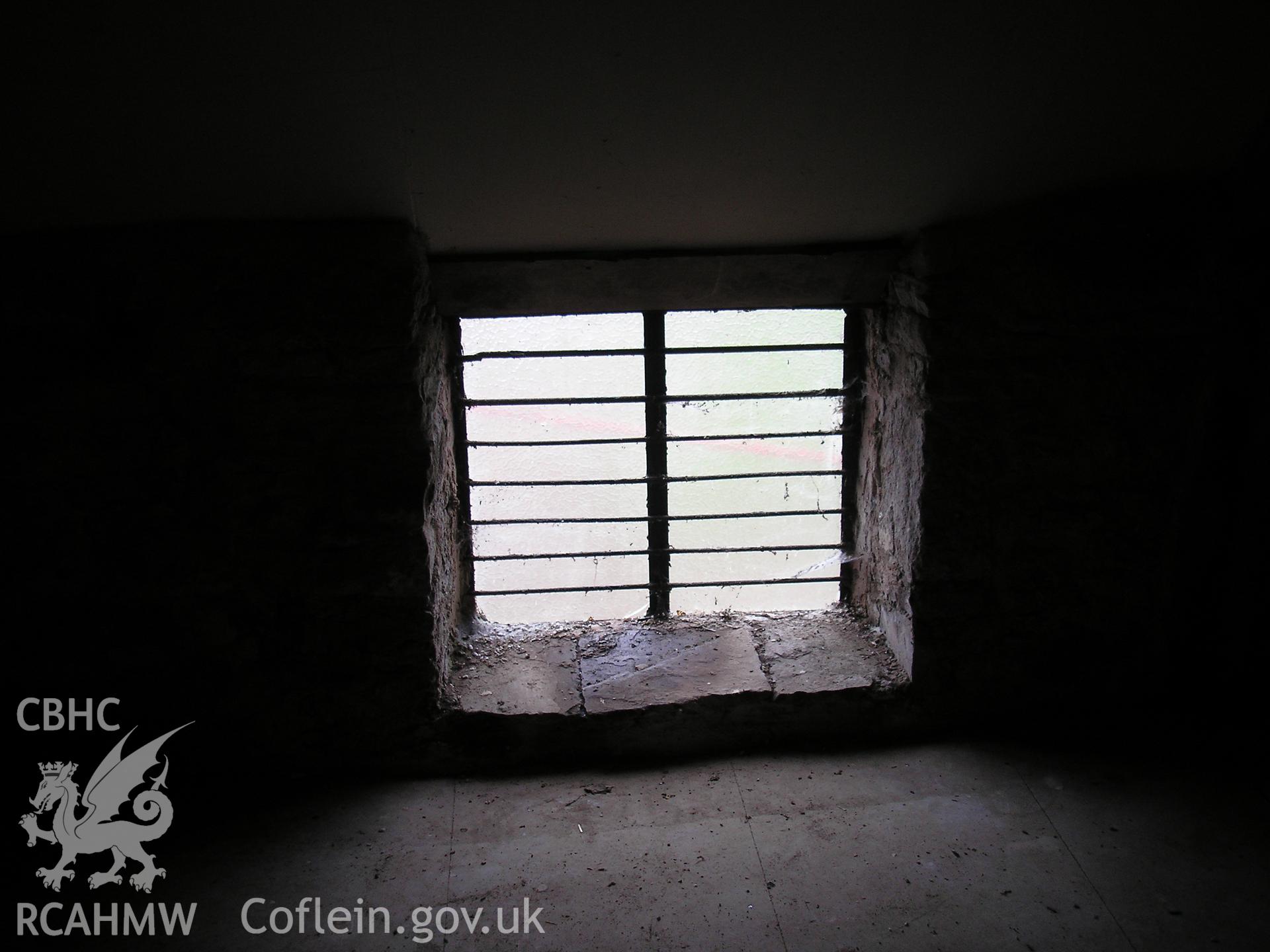 Interior of barn showing window