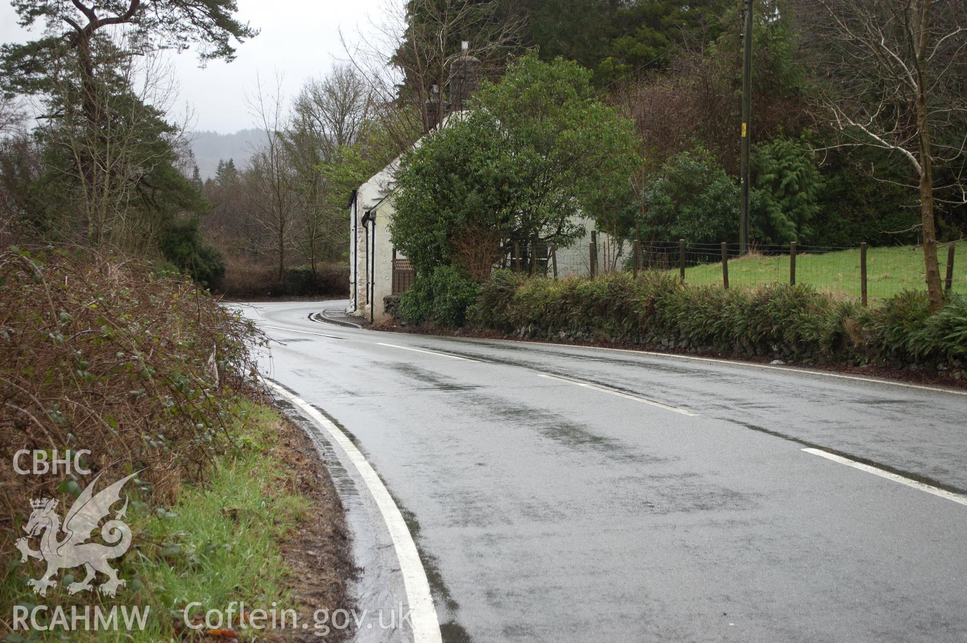 Marian Mawr archaeological assessment; section B-C, view from W showing view along street showing pipeline route in pavement,  taken by Robert Evans of Gwynedd Archaeological Trust, 5th February 2016.