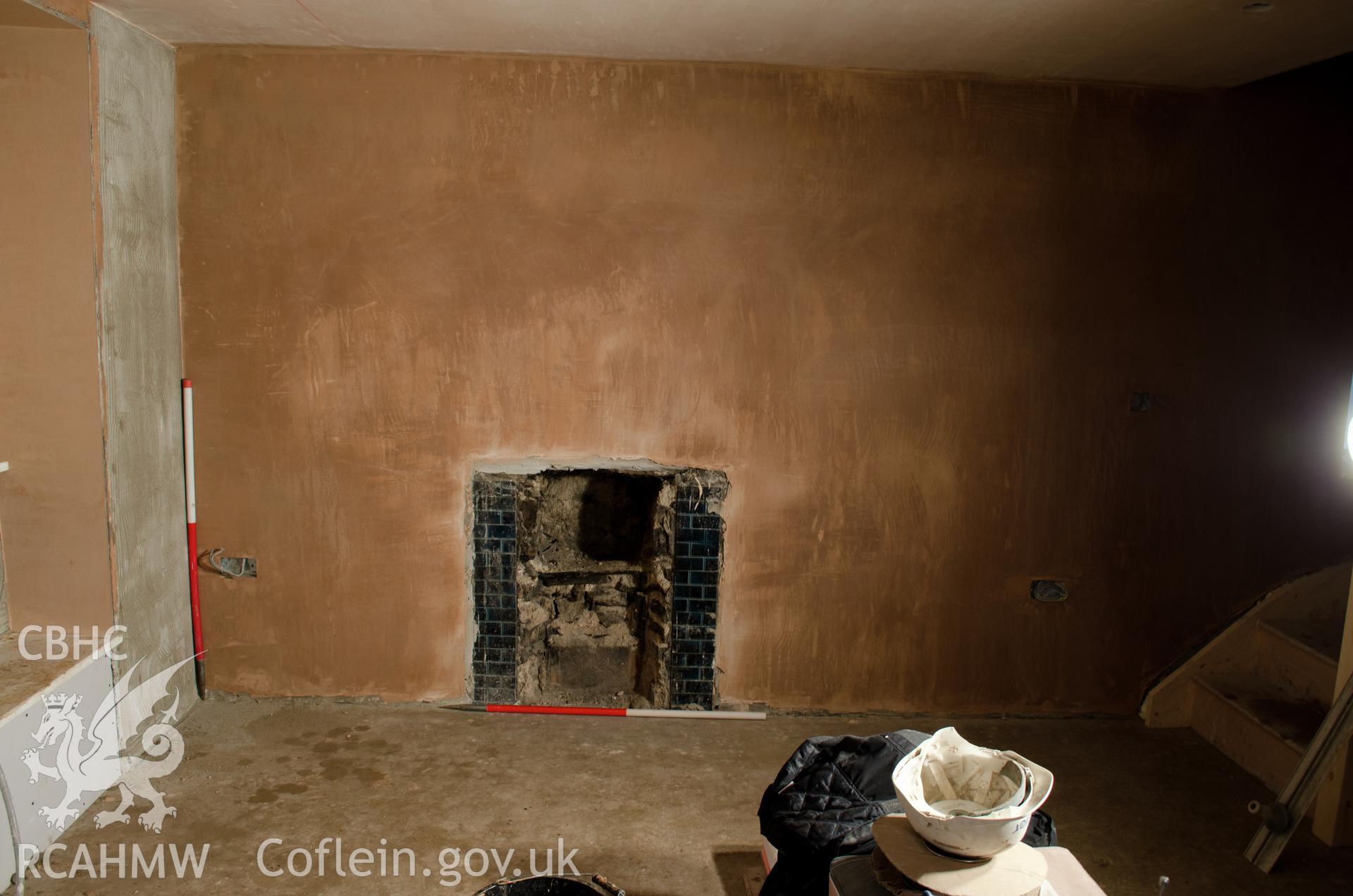 View from the north. "Southern wall of what will be the front lounge, with fire place."