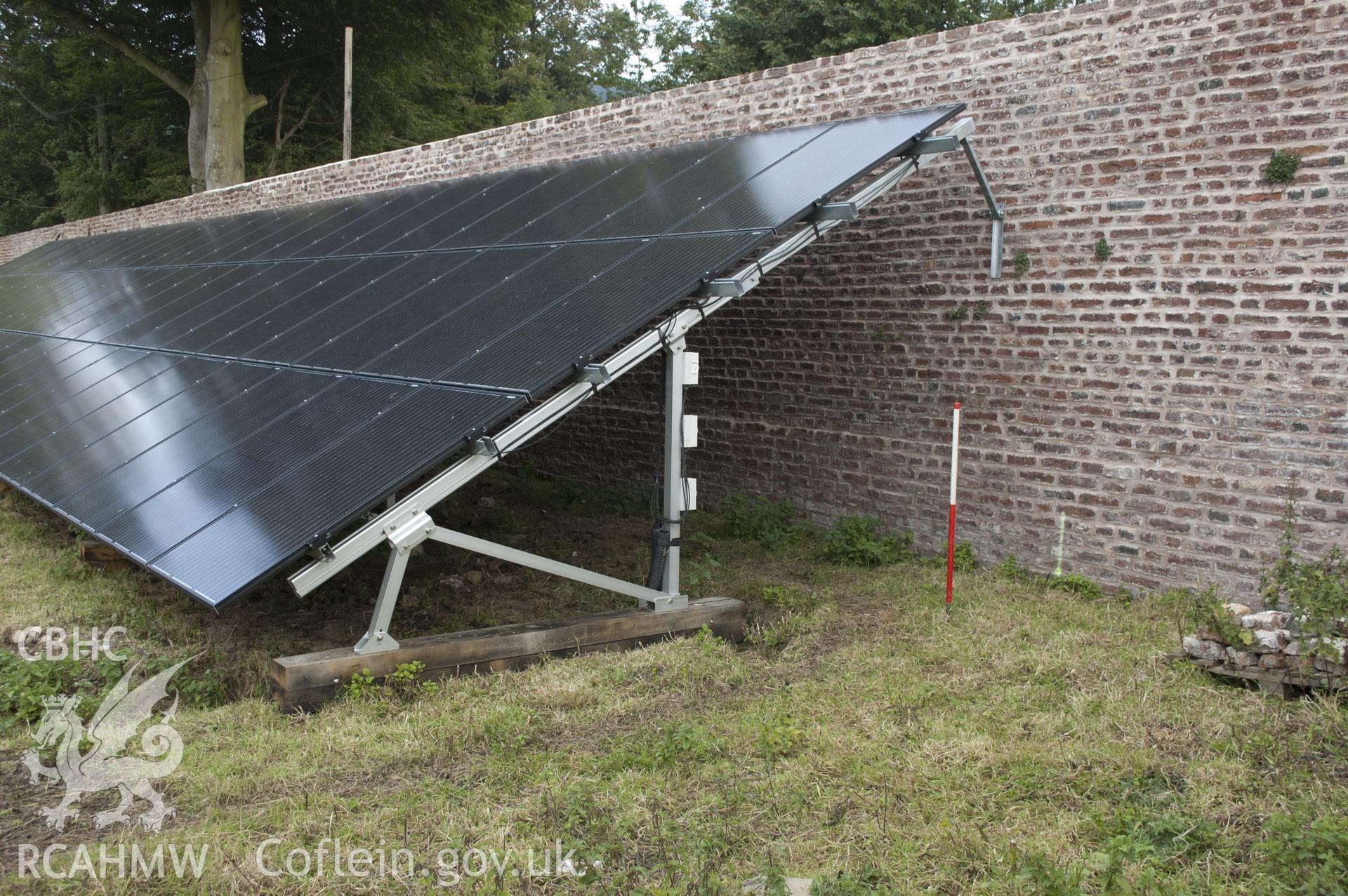 View from west showing solar panel attached to north wall of kitchen garden.