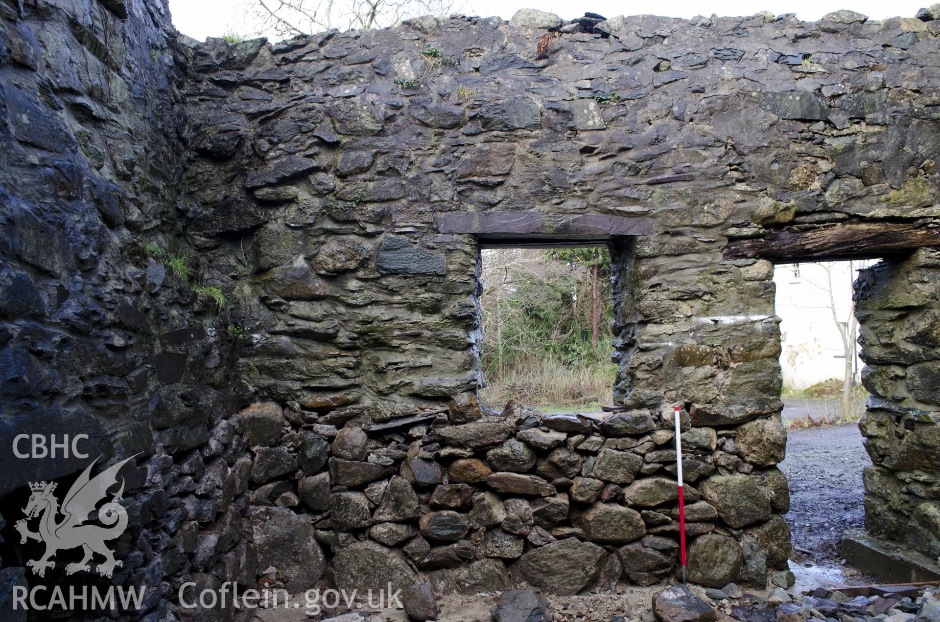 View from south showing NW wall of the SW room, taken by Jessica Davidson, Gwynedd Archaeological Trust, 8th Jan 2016.