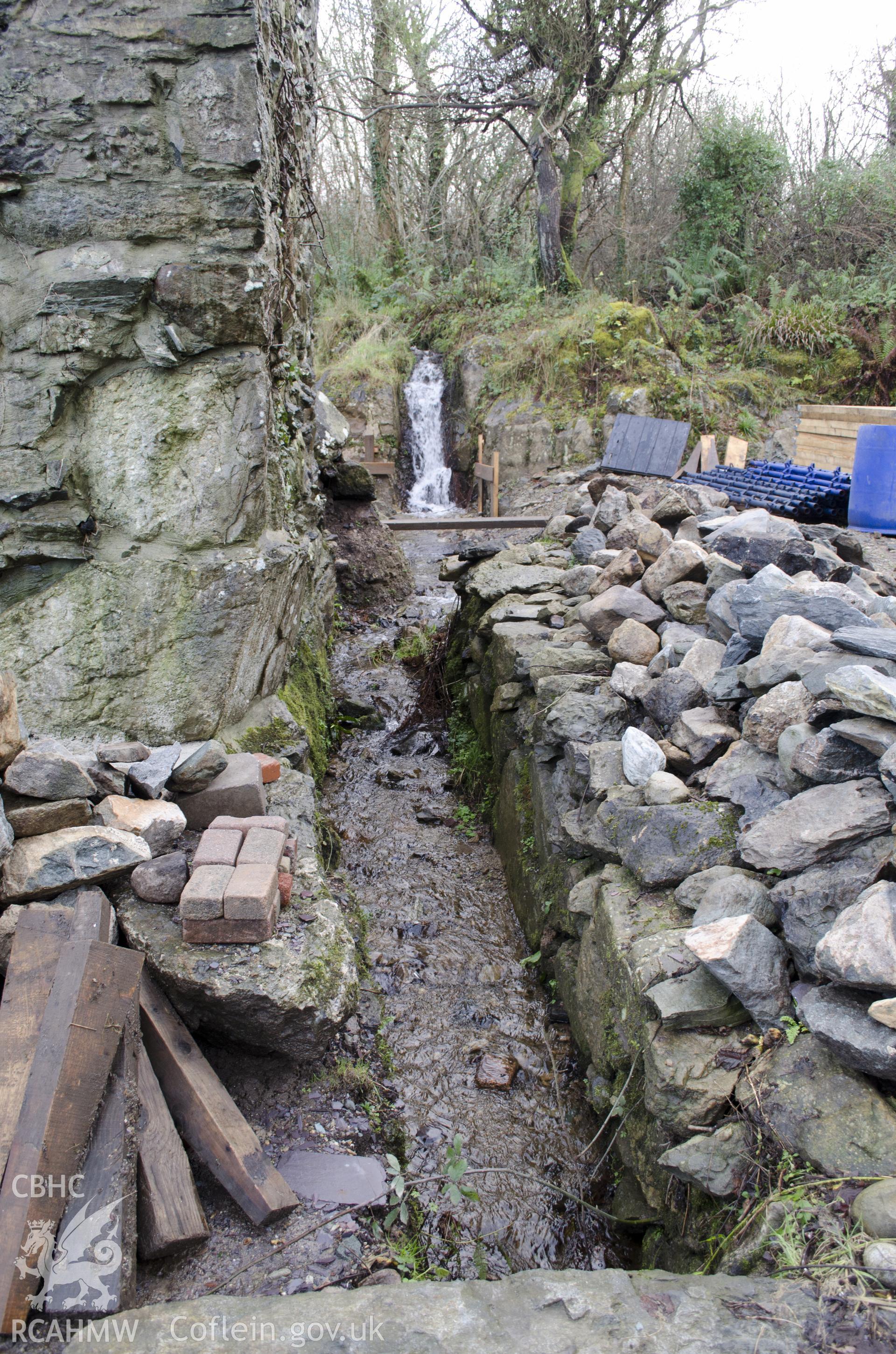 View from north-west showing mill stream at the SW gable, taken by Jessica Davidson, Gwynedd Archaeological Trust, 8th Jan 2016.