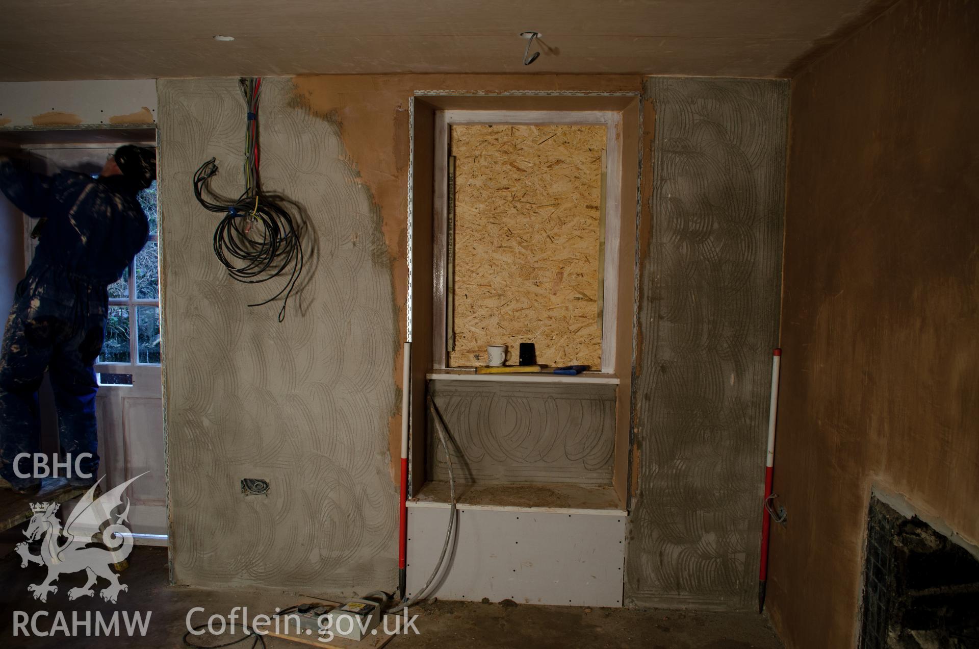 View from the west. "Southeast corner of the house interior, in what will be the front lounge."