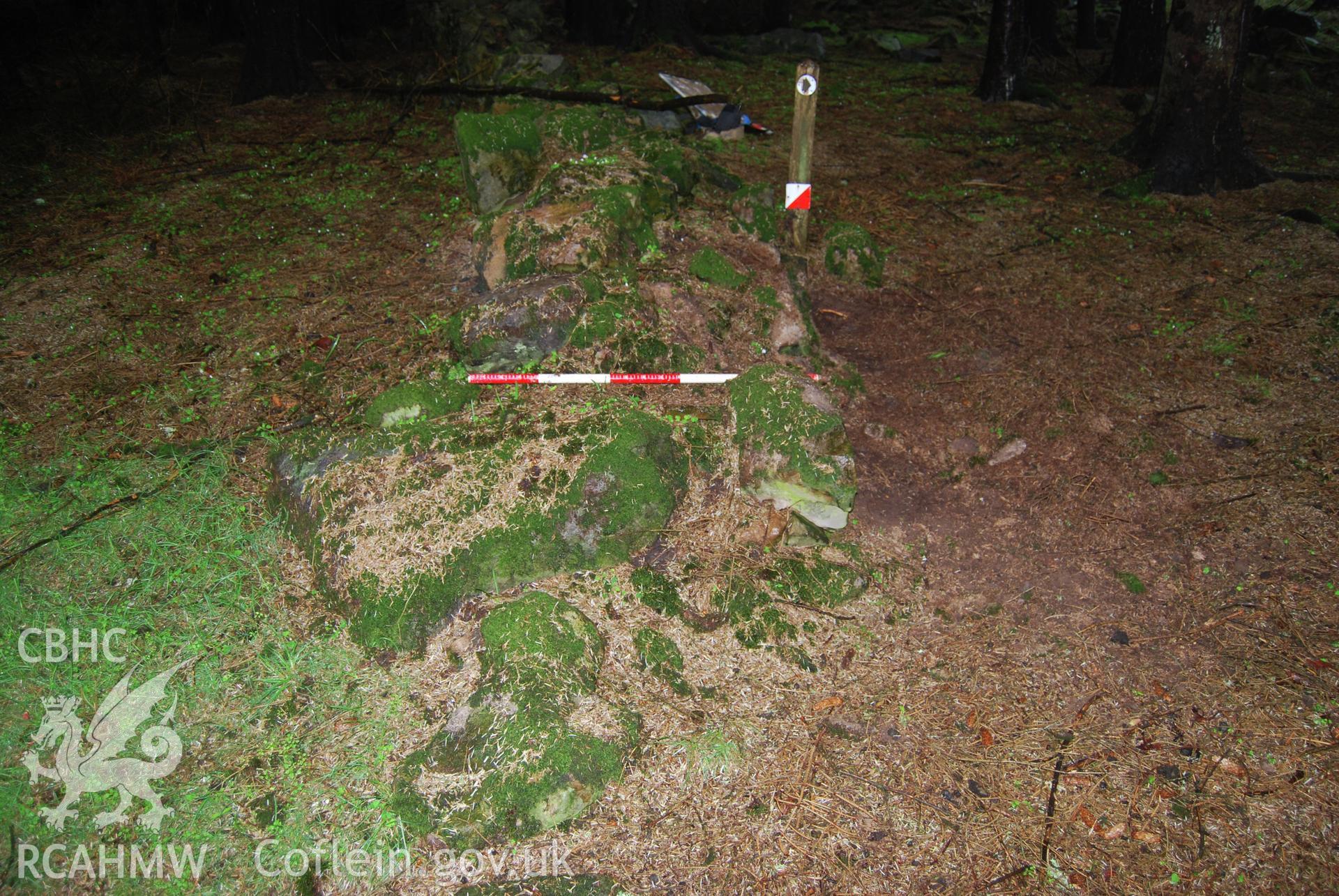 Photo showing 'Pre-ex shot of section of field boundary wall to be removed' from Archaeological Watching Brief of Nant Gwrtheyrn Lower Car Park, Nant Gwrtheyrn, Gwynedd produced by Gwynedd Archaeological Trust in 2013, Project No. G2313, Report No.1208.