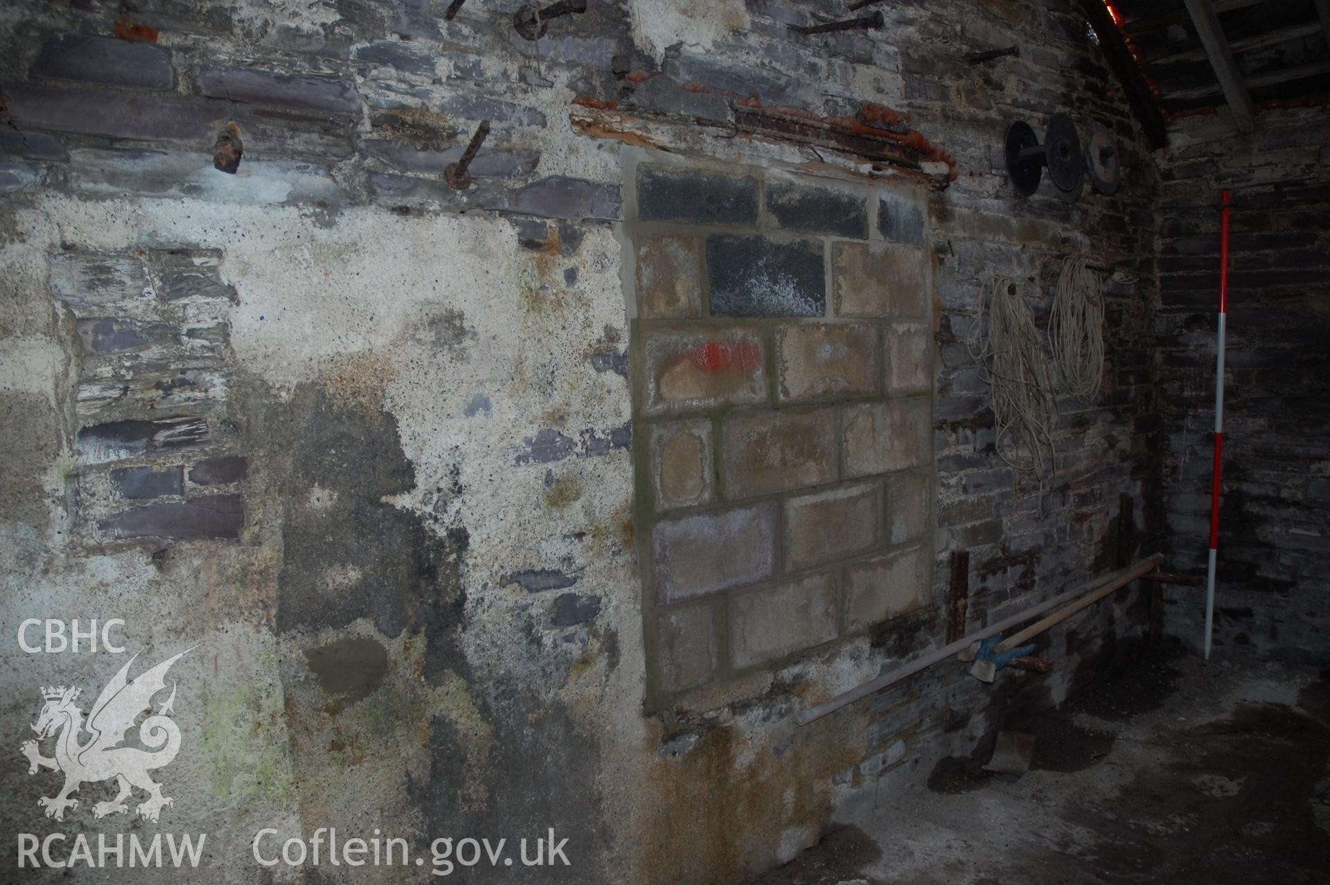 Colour digital photograph of a North East external elevation, showing a blocked door in a building at Pen Yr Orsedd Quarry.