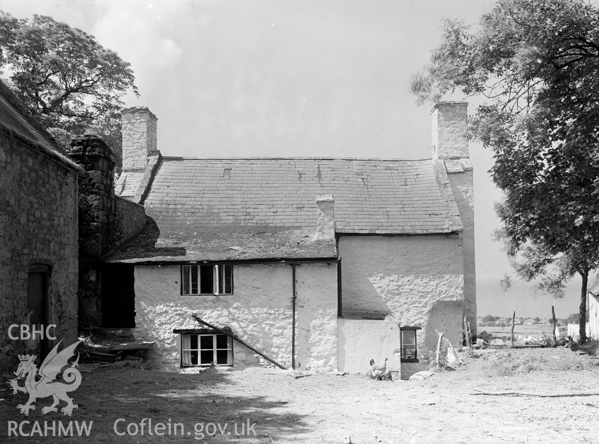 A view of the back of Ty Mawr. The slate roof appears to slant to the east.