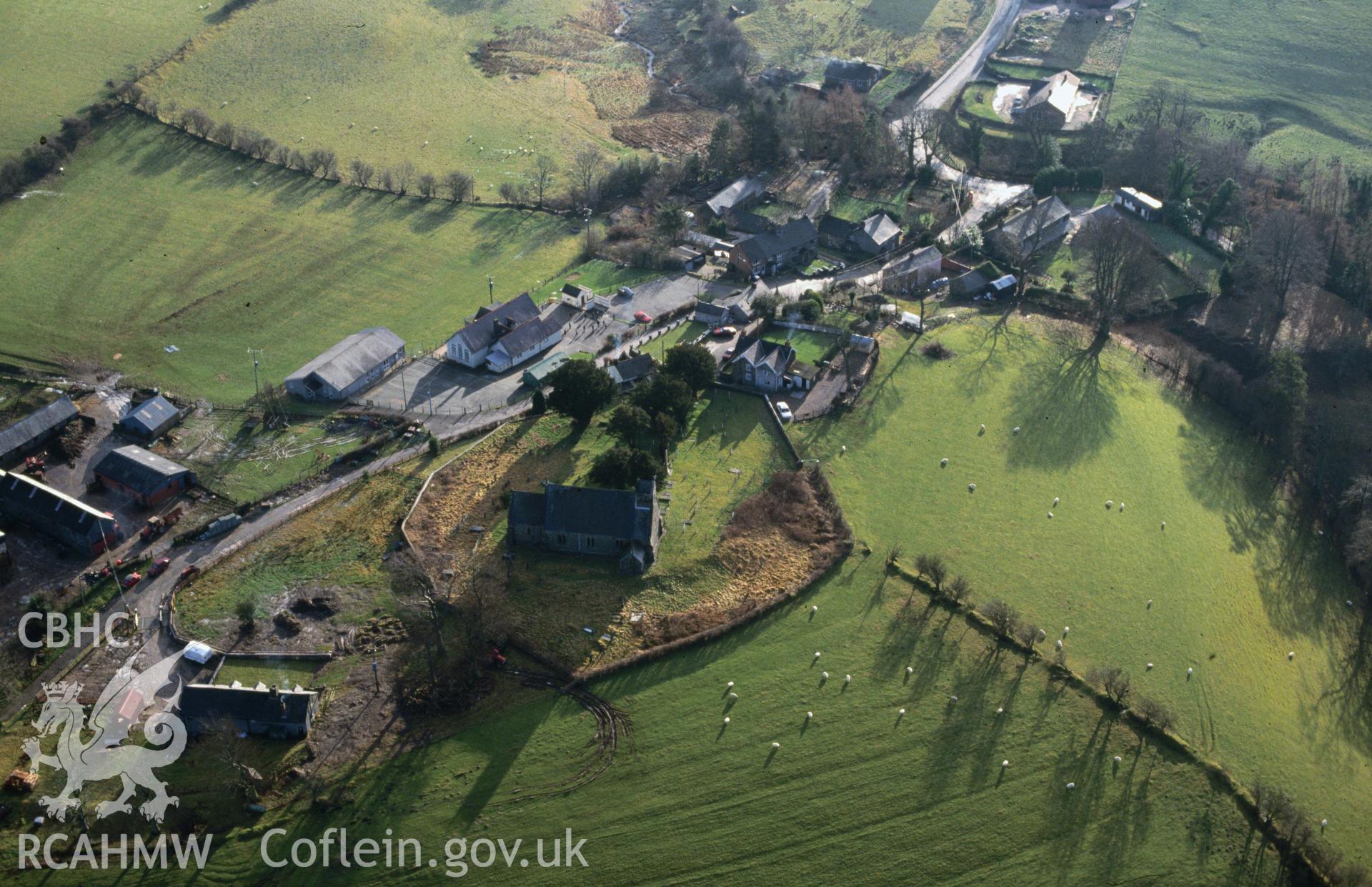 RCAHMW colour slide oblique aerial photograph of St Michael's Church, Llanfihangel, taken by C.R. Musson, 07/01/94