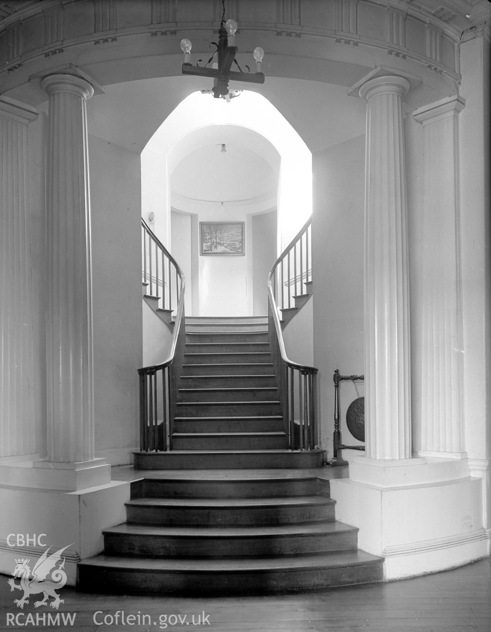 A view the staircase, encased in a small rotunda and lit from a small lantern dome.