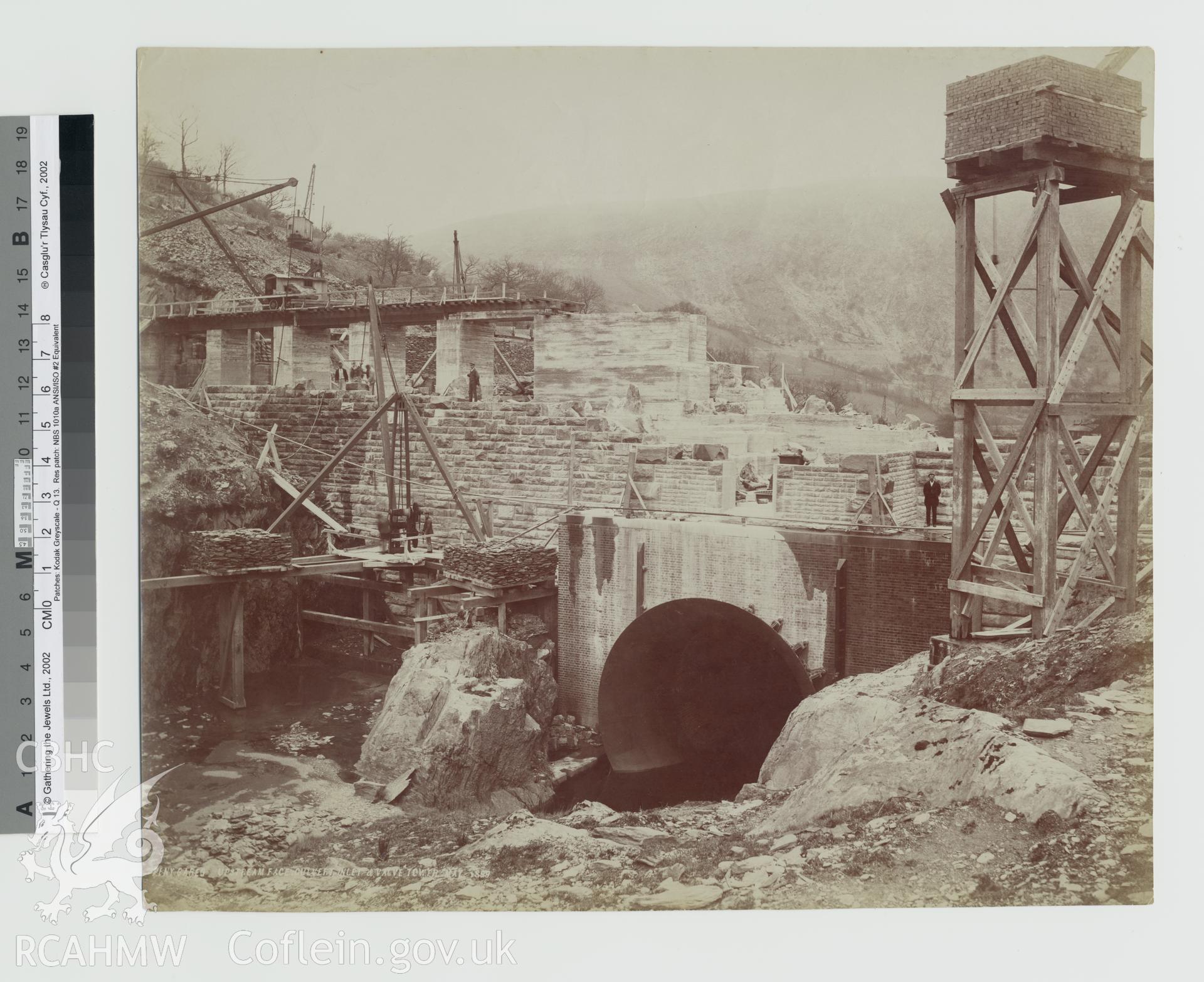 Black and white photograph of Pen Y Gareg dam showing upstream face culvert inlet and valve tower. Copy negative held.