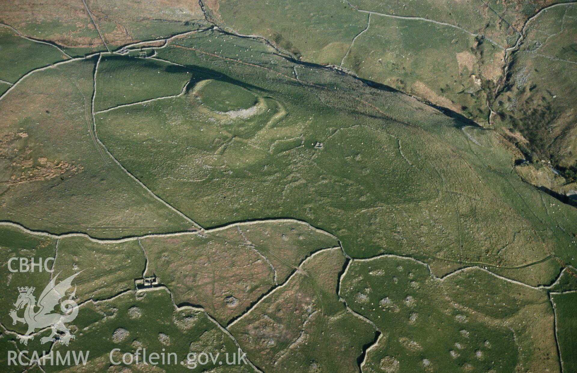 Slide of RCAHMW colour oblique aerial photograph of Pen Y Dinas, taken by C.R. Musson, 25/4/1989.