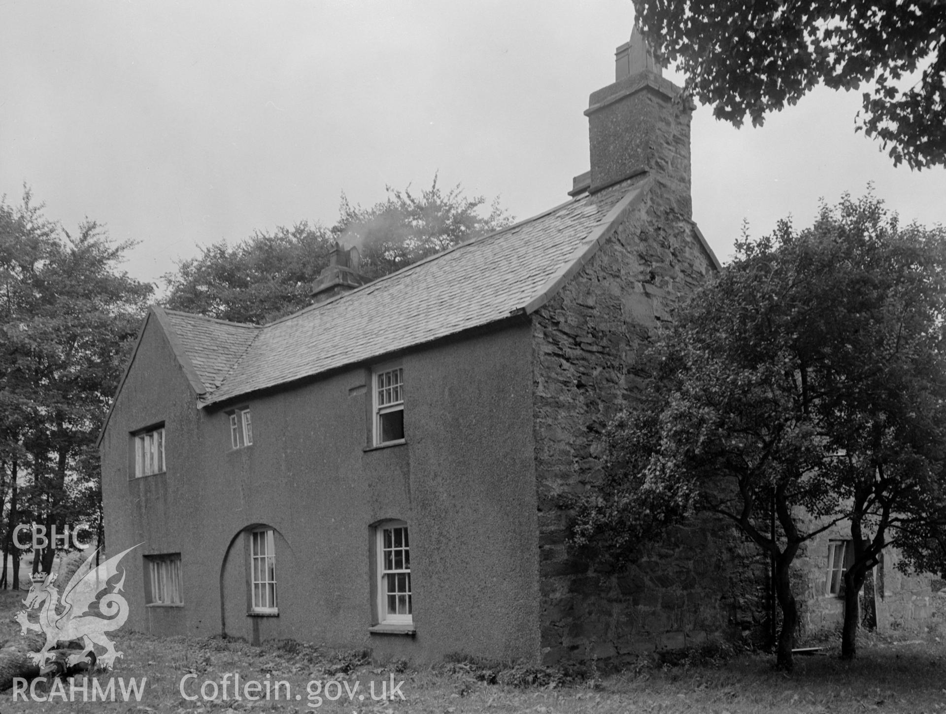 A picture from the south east showing slate roof, gable chimney and sash windows.