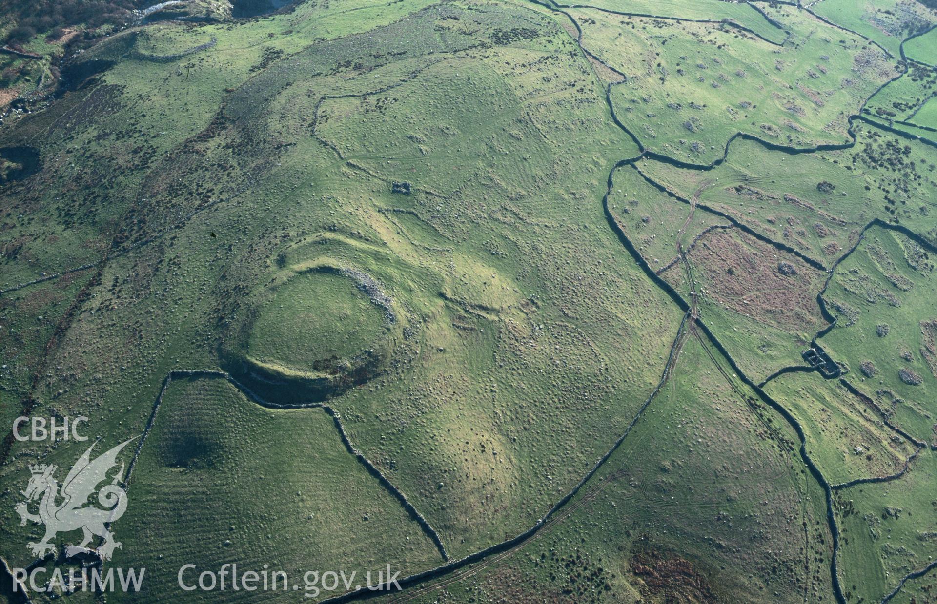 Slide of RCAHMW colour oblique aerial photograph of Pen Y Dinas, taken by C.R. Musson, 31/3/1997.