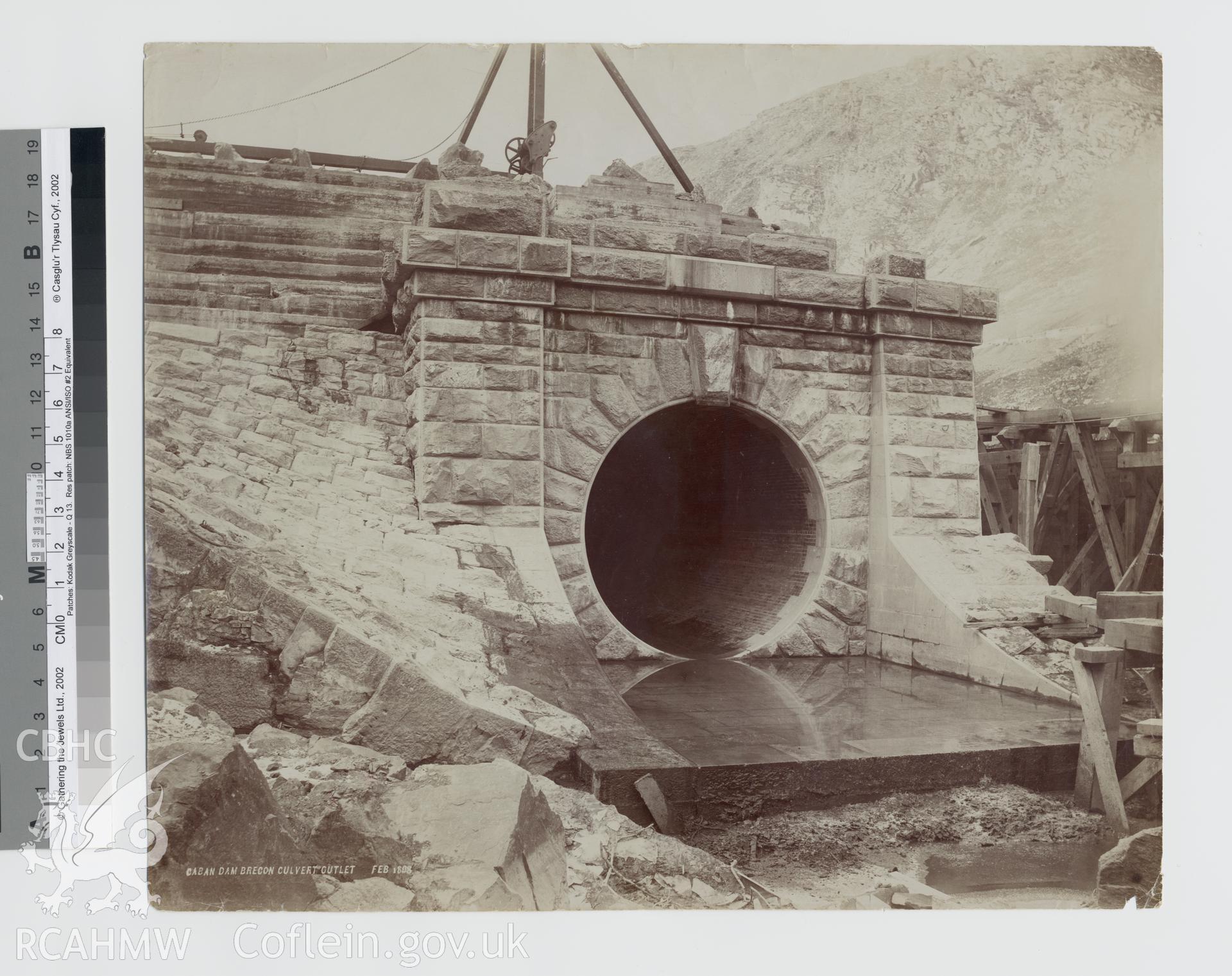 Black and white photograph of Caban Coch Dam, showing culvert outlet. Copy negative held.