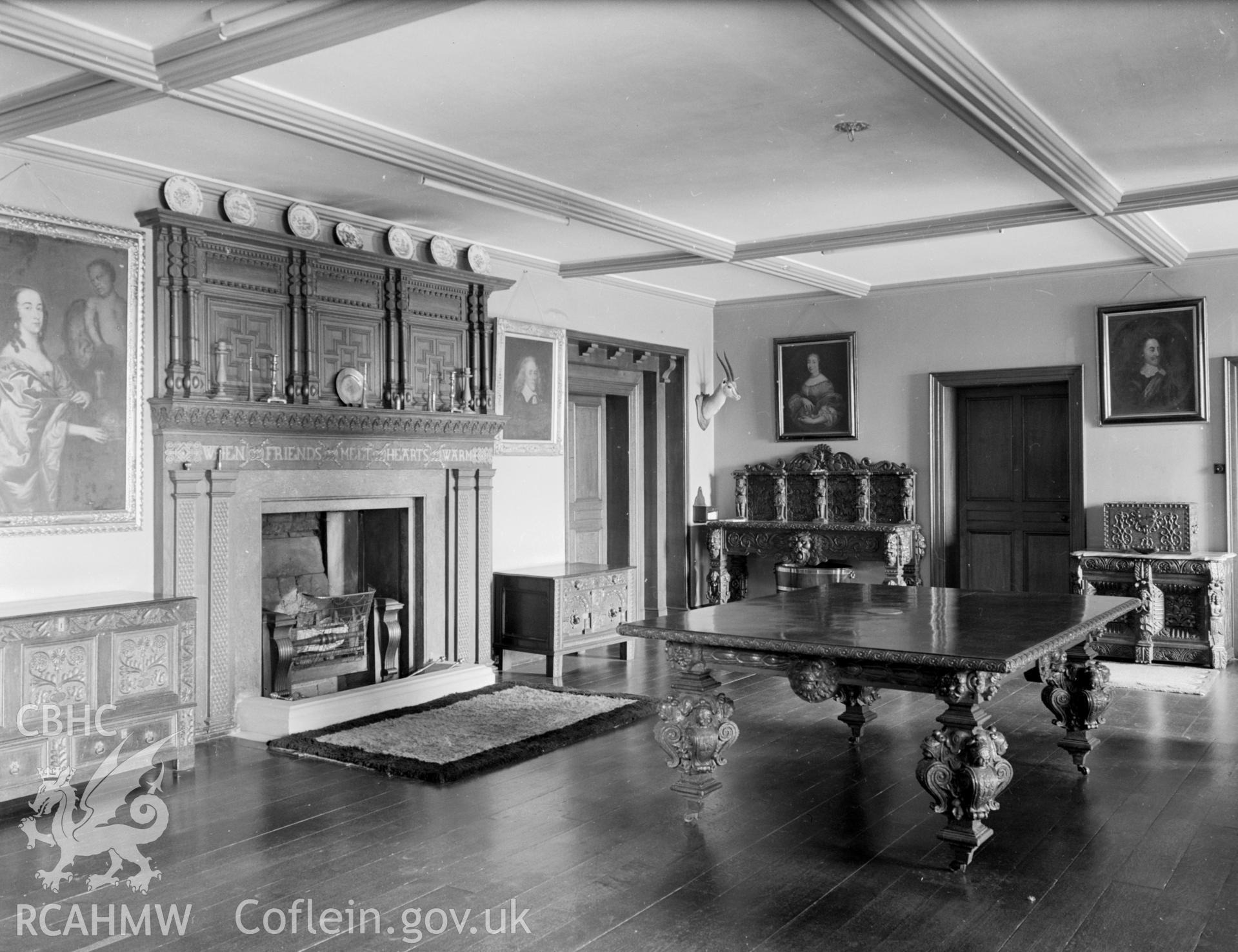 A view of the west entrance hall, showing a beamed ceiling and wooden flooring.