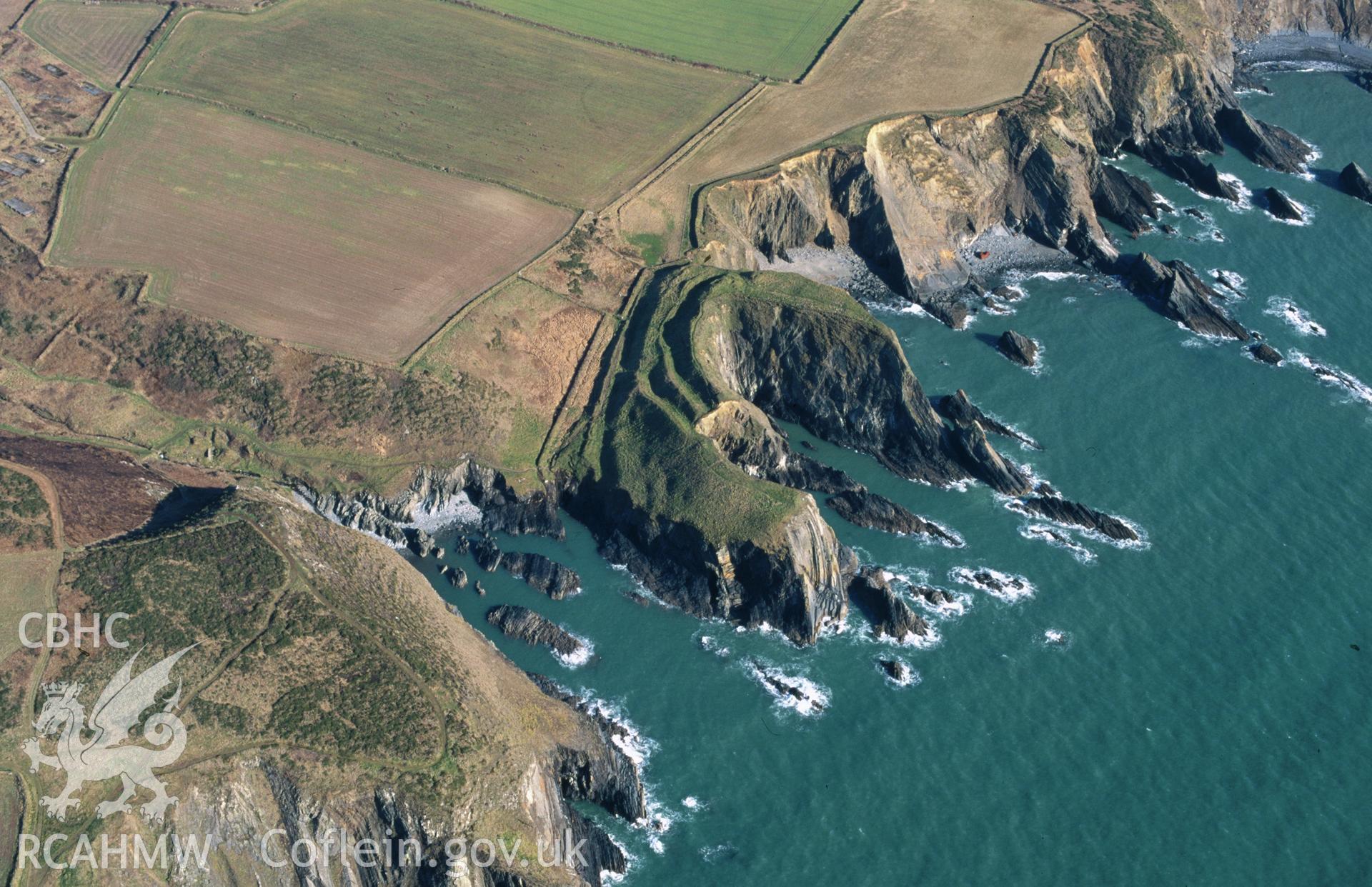 RCAHMW colour slide oblique aerial photograph of Porth-y-rhaw Promontary Fort, Solva, taken by C.R.Musson on the 27/02/1996