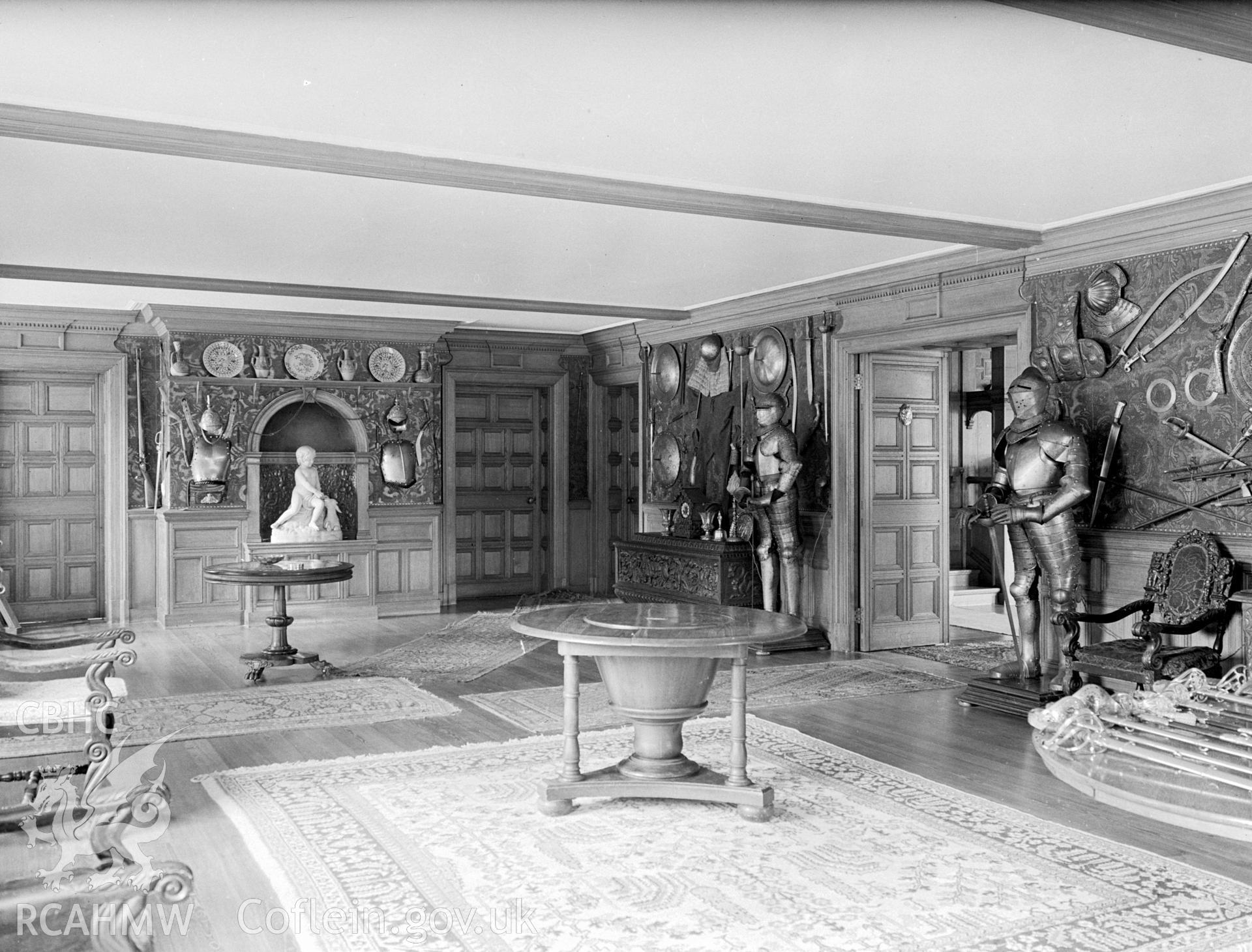 The west entrance of the Hall. With wood panelled walls and a wooden flooring.