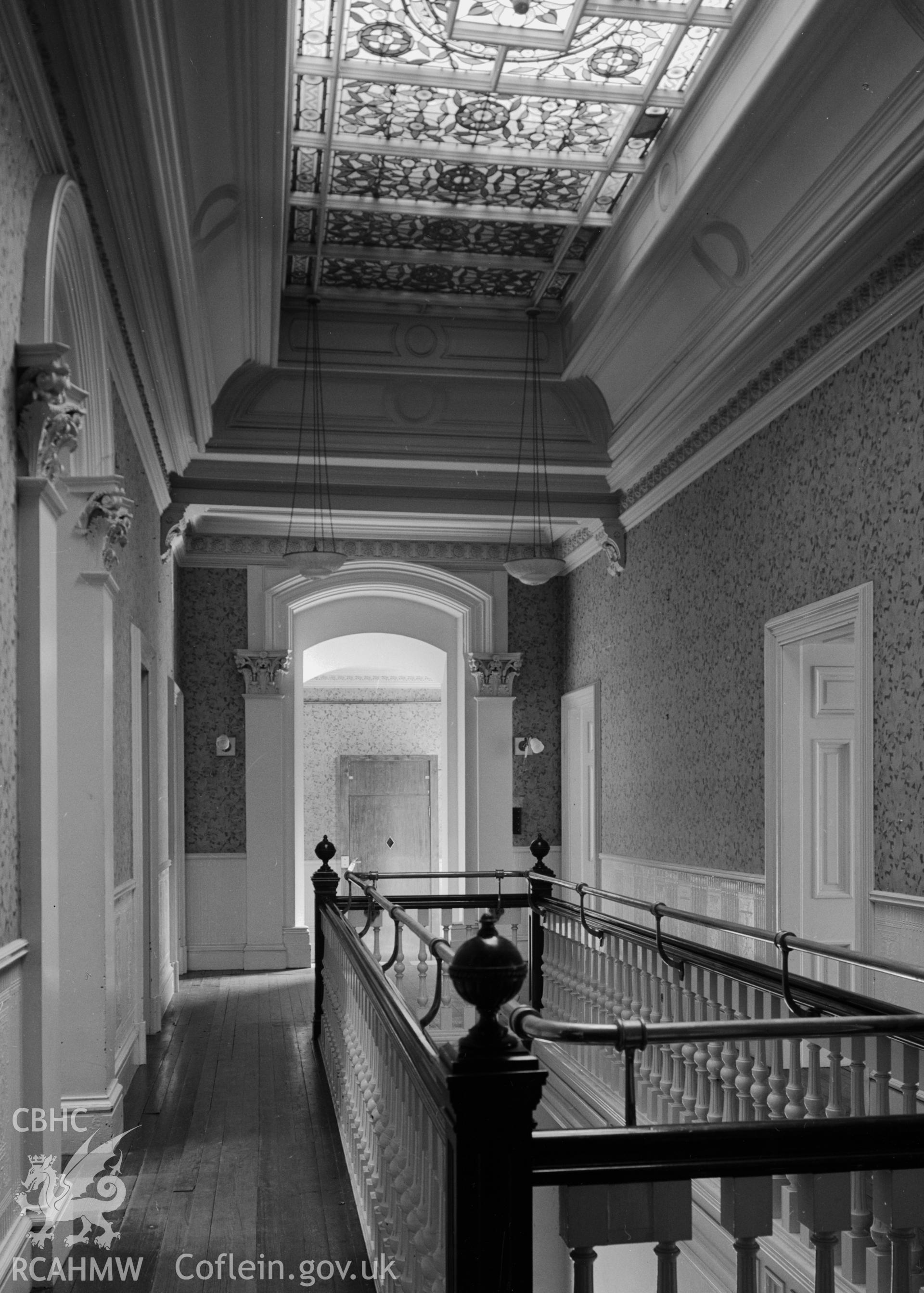 A view of the landing and well over the north entrance. The ceiling is made of glass.