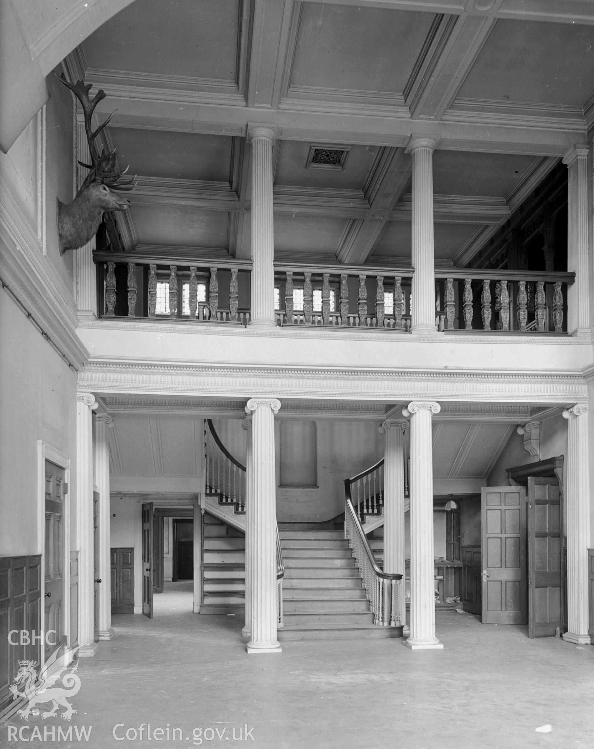 The south entrance hall: A view of a large impressive hallway with the staircase at the centre.