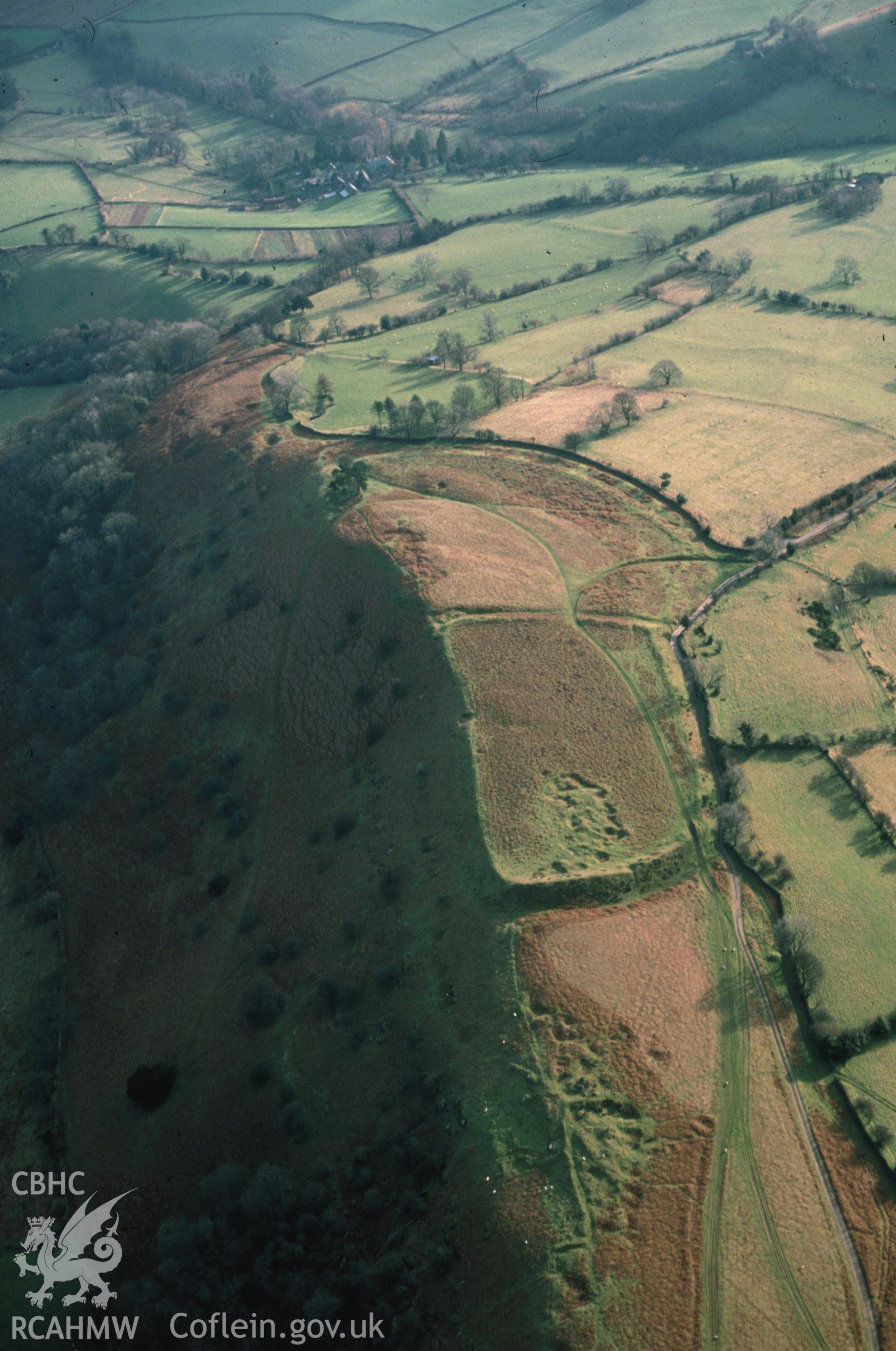Slide of RCAHMW colour oblique aerial photograph of Pen-twyn Earthwork, taken by C.R. Musson, 7/12/1988.