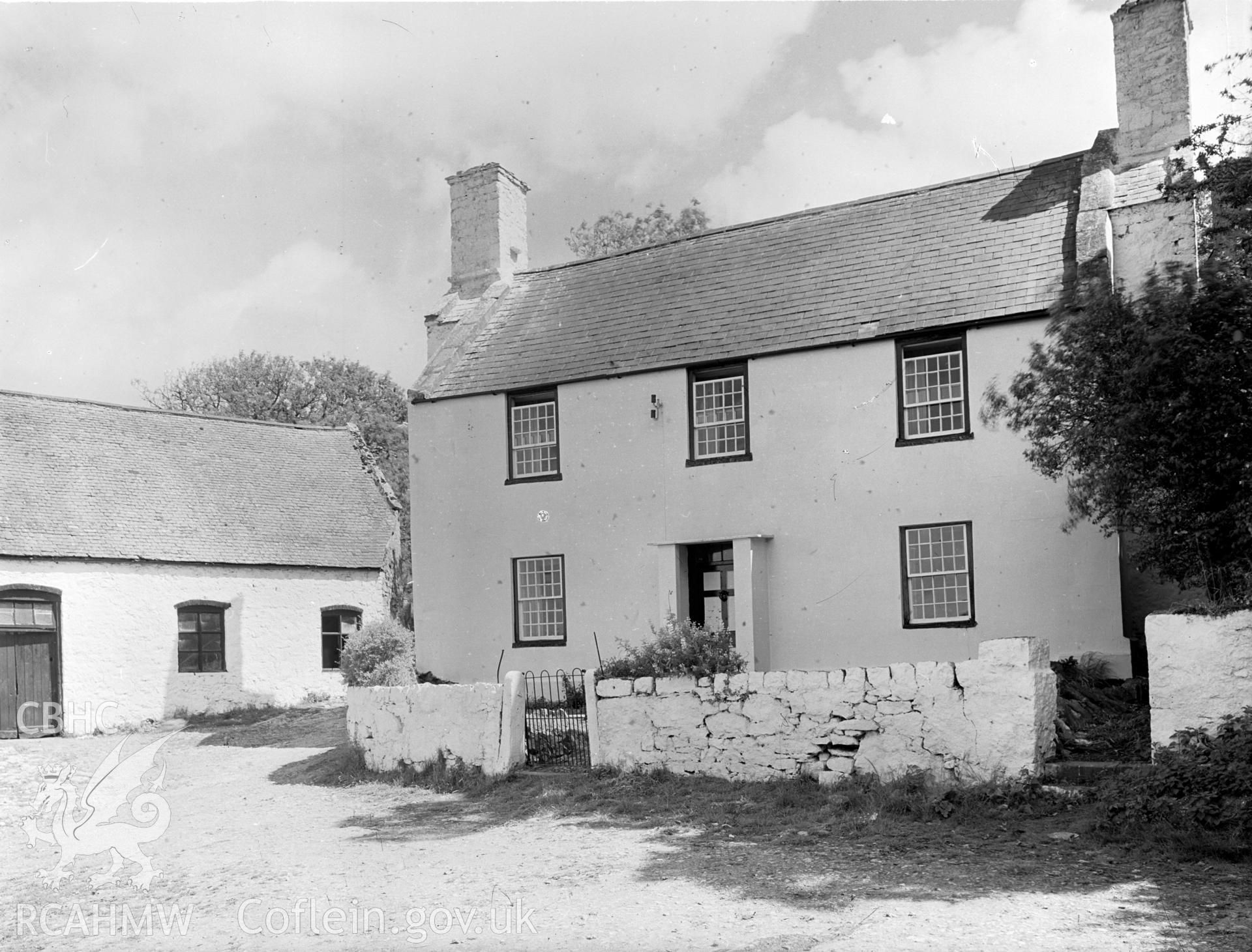 Front of Ty Mawr. Sash windows and a plain rectangular porch.