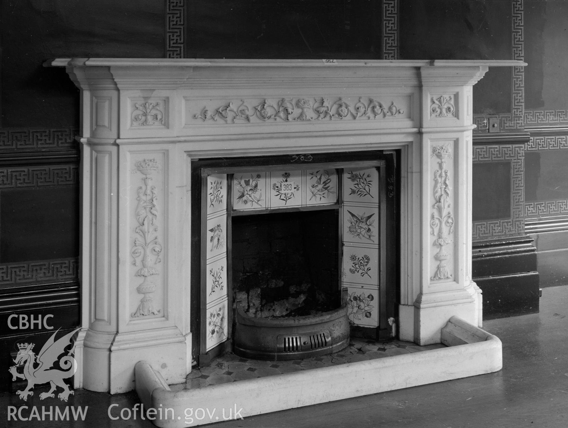 Carved marble fireplace. Centre of the fireplace is tiled.