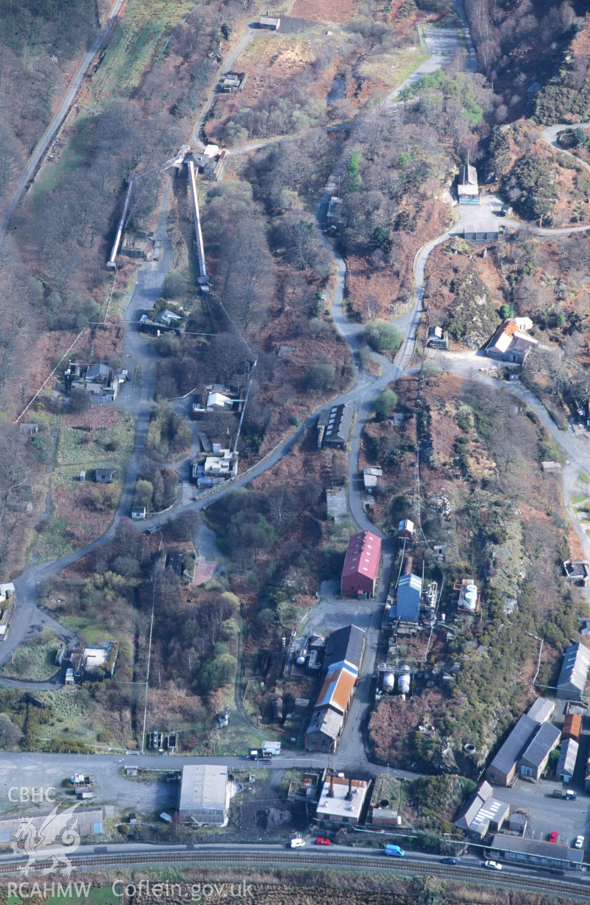 RCAHMW colour oblique aerial photograph of Cooke's Explosive Works, Penrhyndeudraeth taken on 12/04/1995 by C.R. Musson