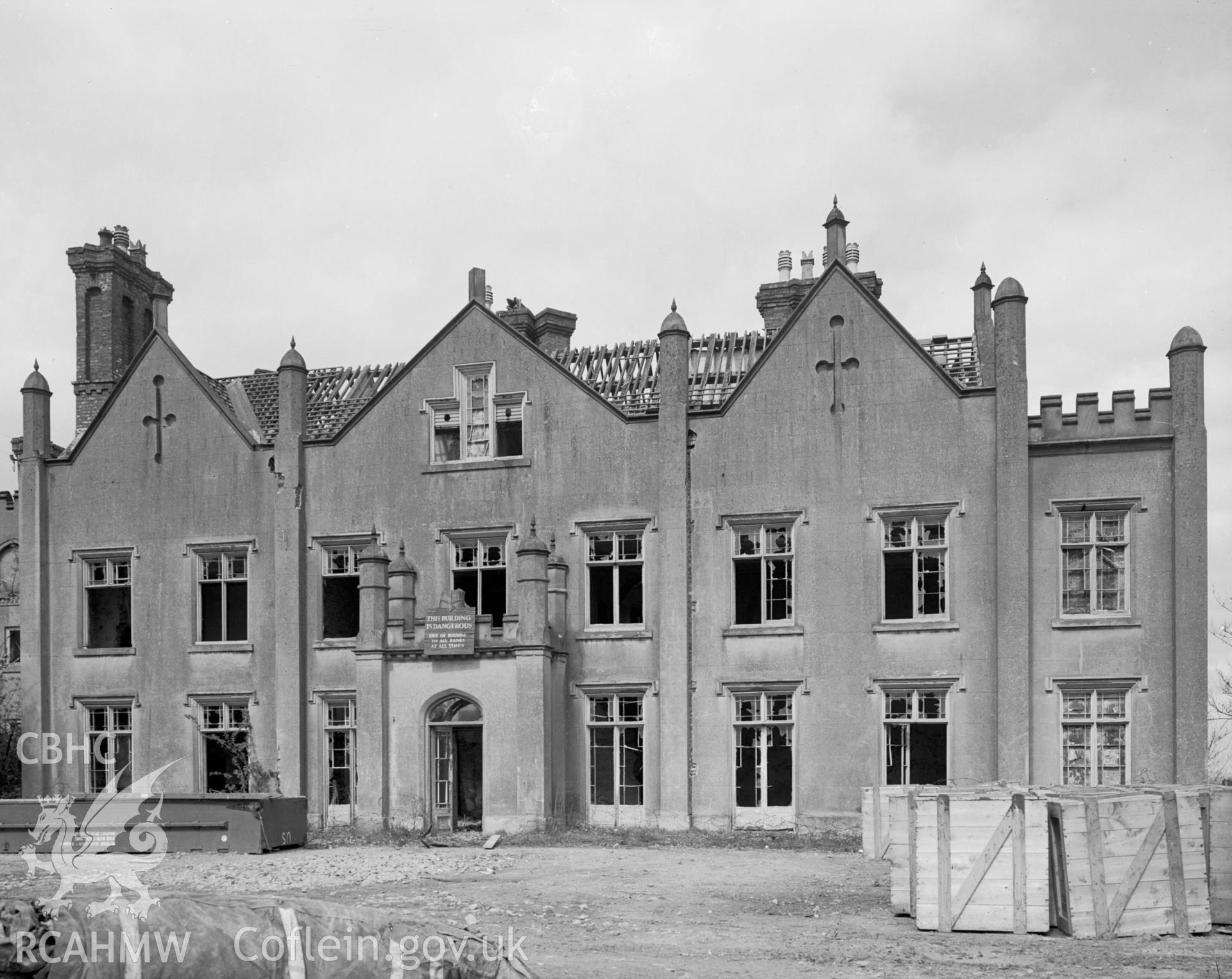 Exterior view of the west elevation showing stucco on brick.