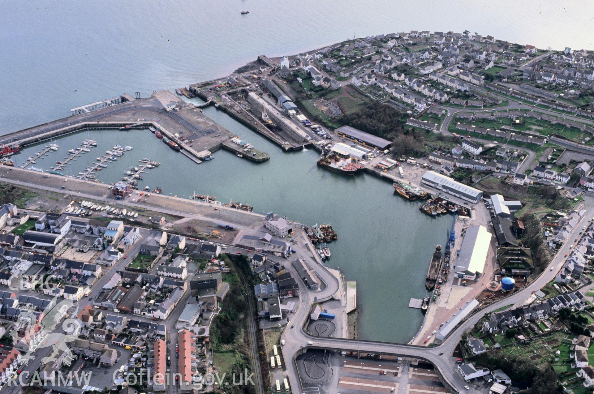 Slide of RCAHMW colour oblique aerial photograph of Milford Haven Dockyard, taken by C.R. Musson, 27/2/1993.