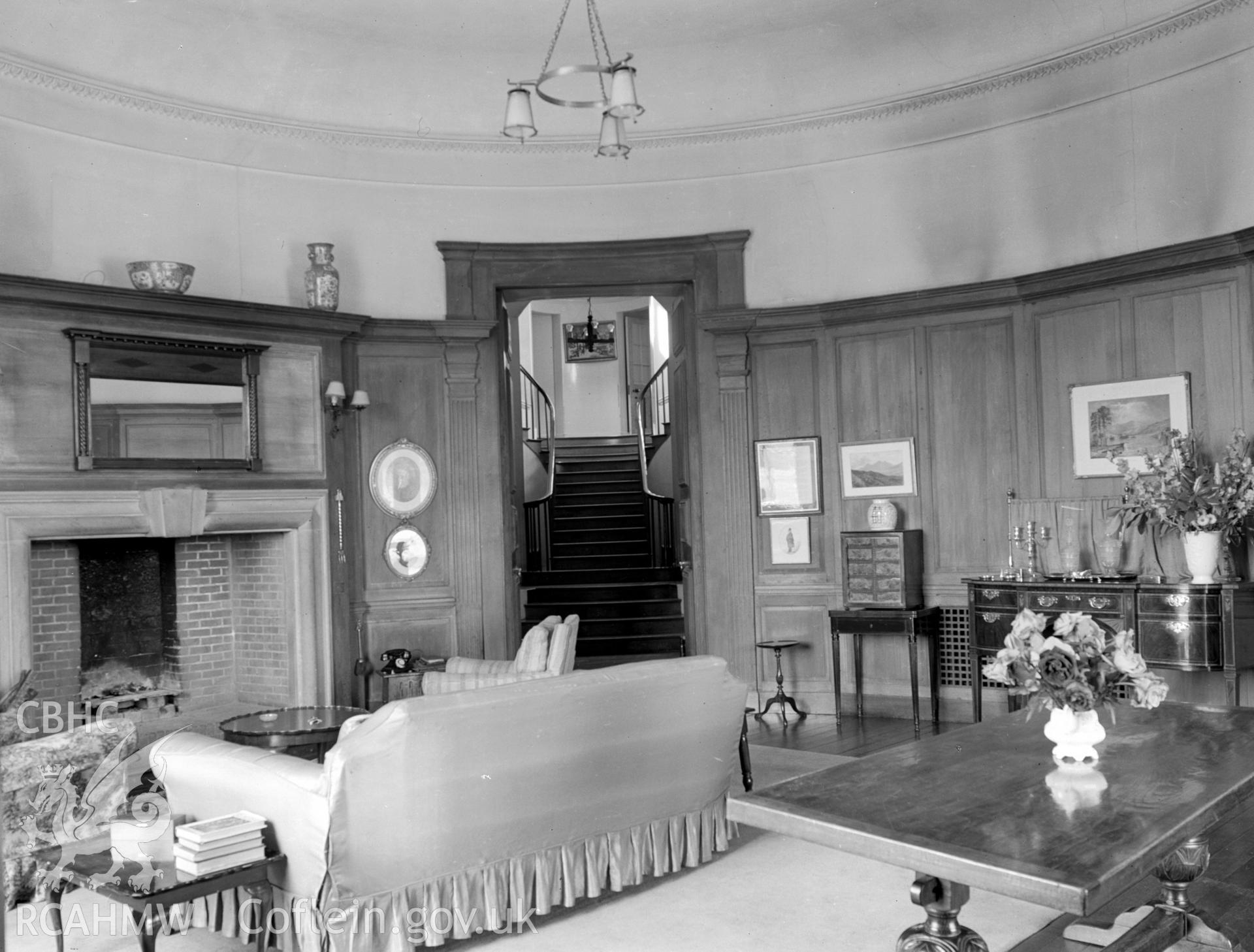 The south east extension, showing a large simple brick hearth and wooden panelling on the walls.