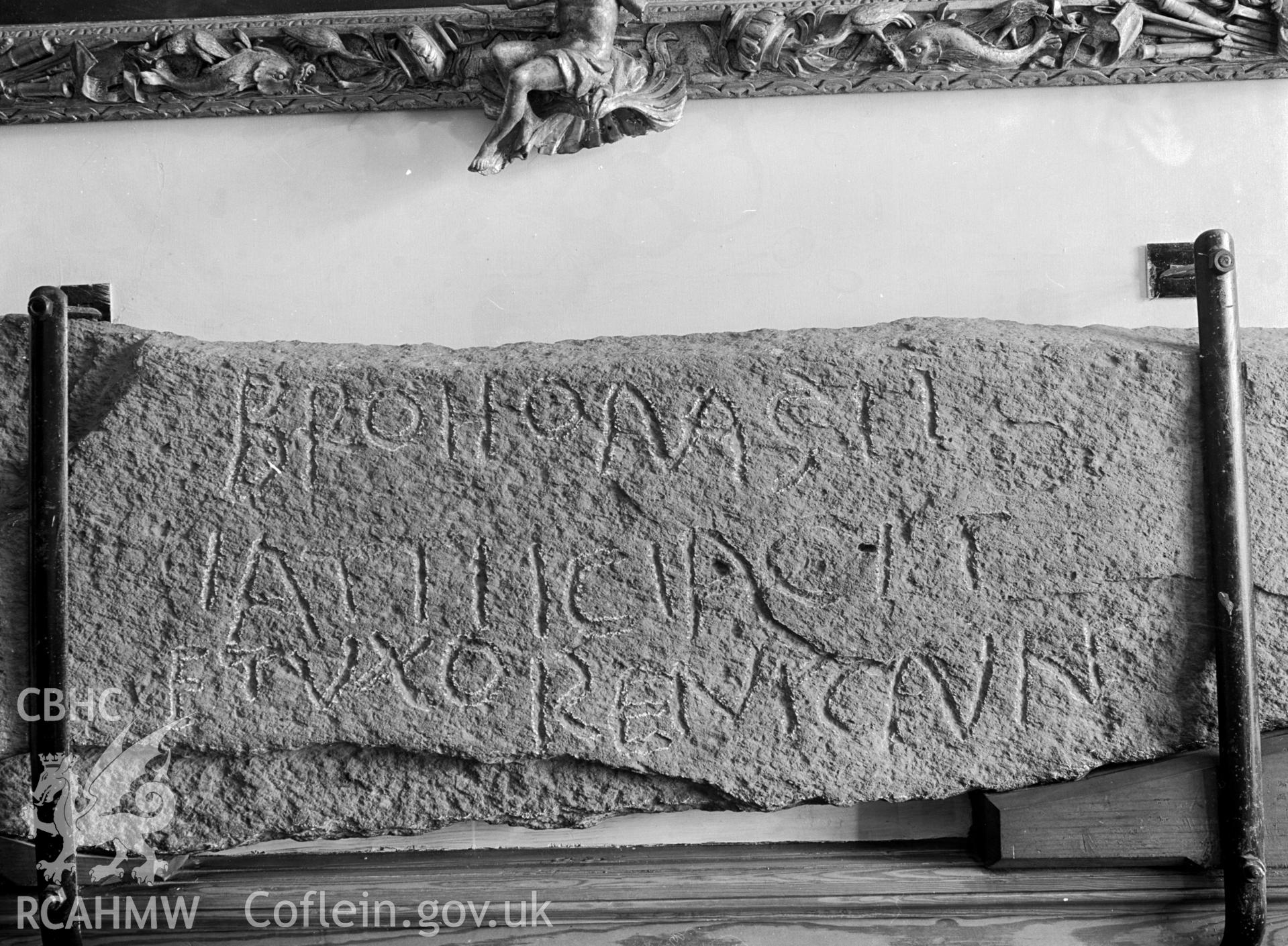 A picture of the Brohomaglus stone. A mounted stone with an inscription.